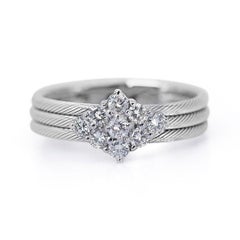 Glamorous diamond ring features a dazzling 0.56 carat round brilliant diamond
