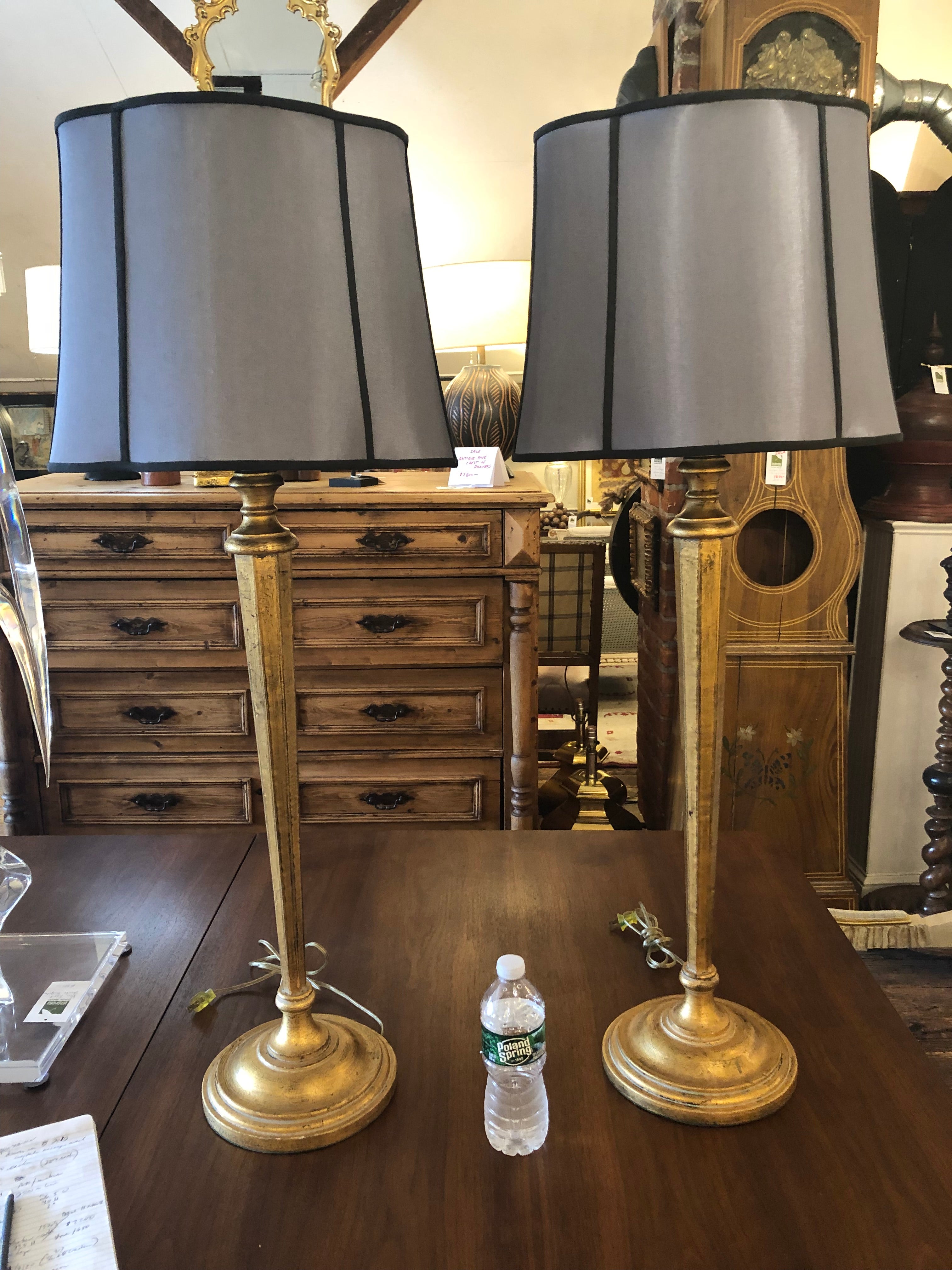 Very elegant tall elongated giltwood table lamps having stunning grey and black silk shades.