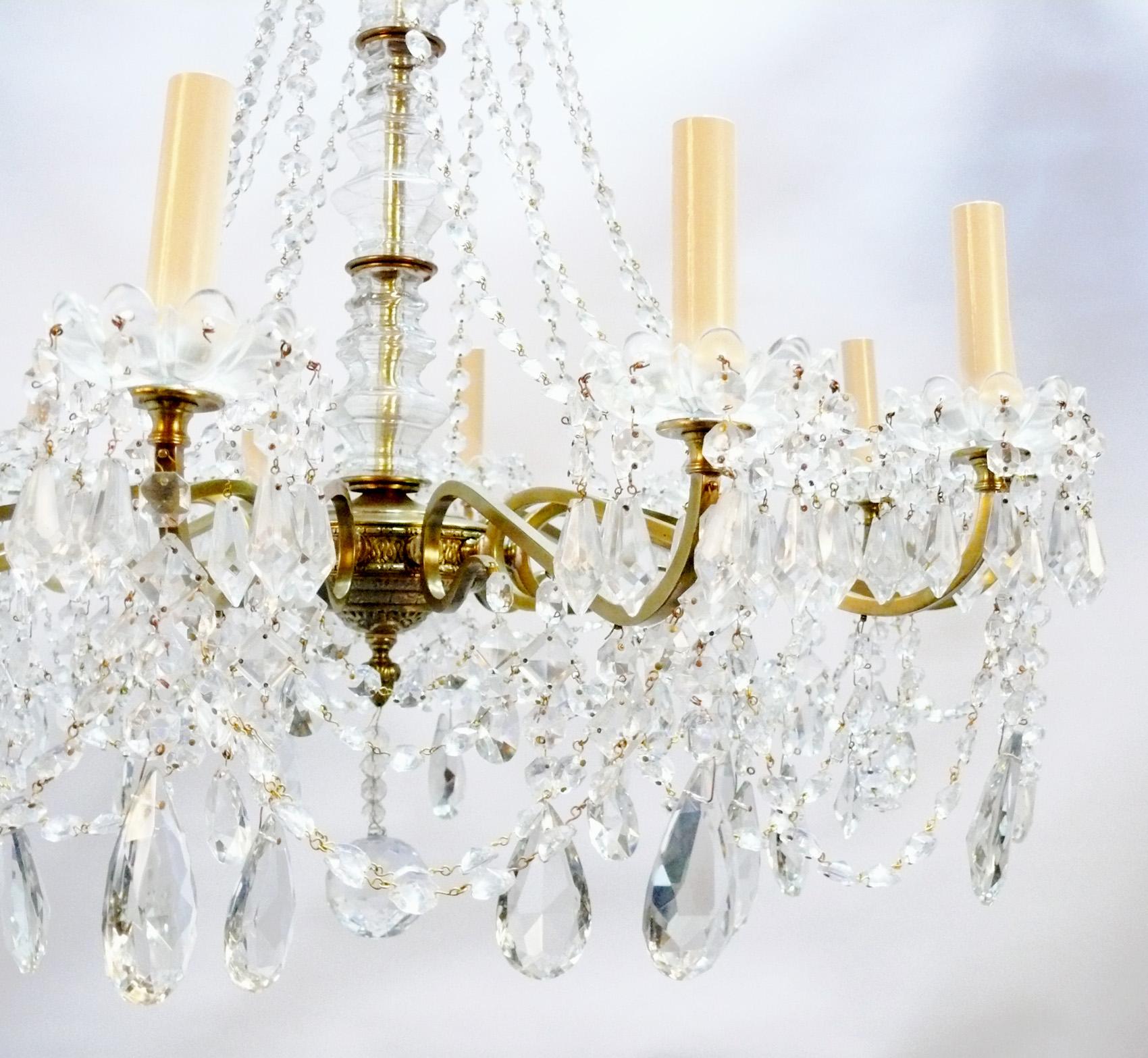 Glamorous French crystal chandlier with brass armature, France, circa 1950s. Looks incredible when lit! It has been rewired and is ready to mount.