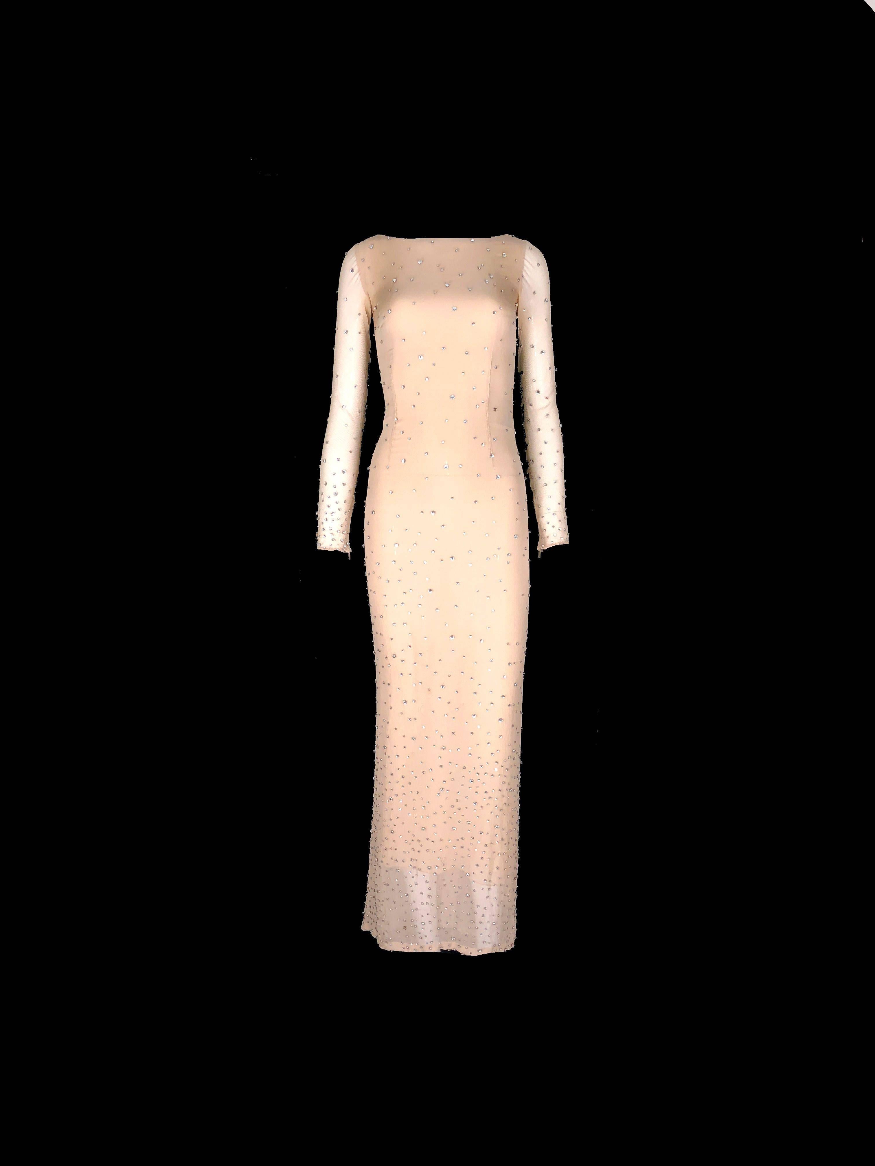 
Rare Collector's item

Beautiful nude evening silk evening gown
Embroidered with shiny Swarovski crytals

Designed by Tom Ford for Gucci's 2000 Millenium Collection
A rare piece not made for the RTW collections in stores

Tom Ford designed a