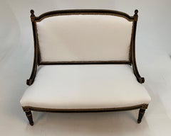Glamorous Hollywood Regency Ebonized Gilded Settee with White Leather Upholstery