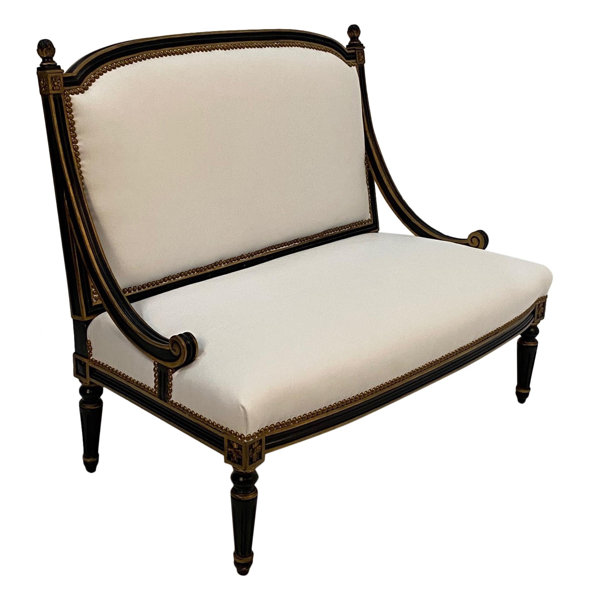 Glamorous Hollywood Regency Ebonized Gilded Settee with White Leather Upholstery