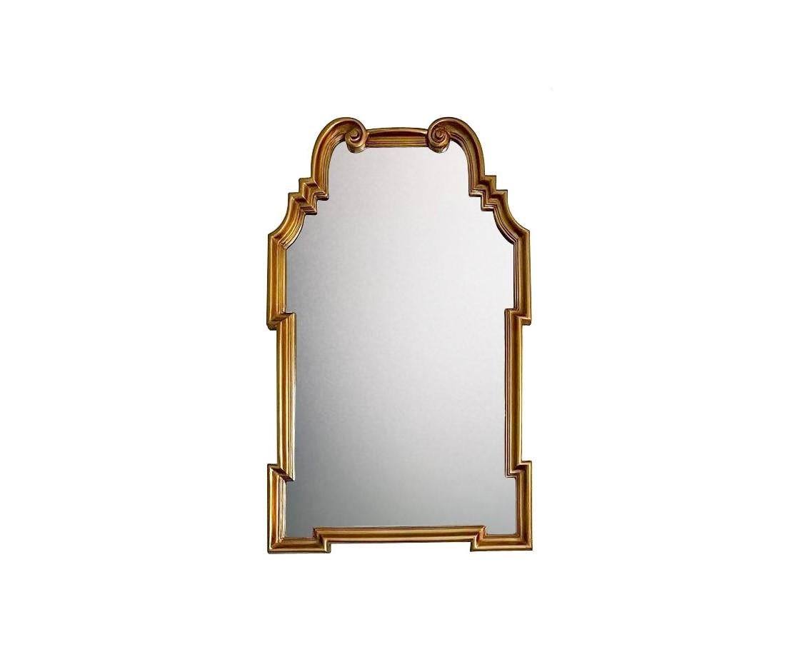 Timeless quality from La Barge, a matched pair of vintage scroll form arch top giltwood mirrors an exemplar of imaginative design with beautifully aged gilded surface and underlying red bole showing. Using the finest materials and the best