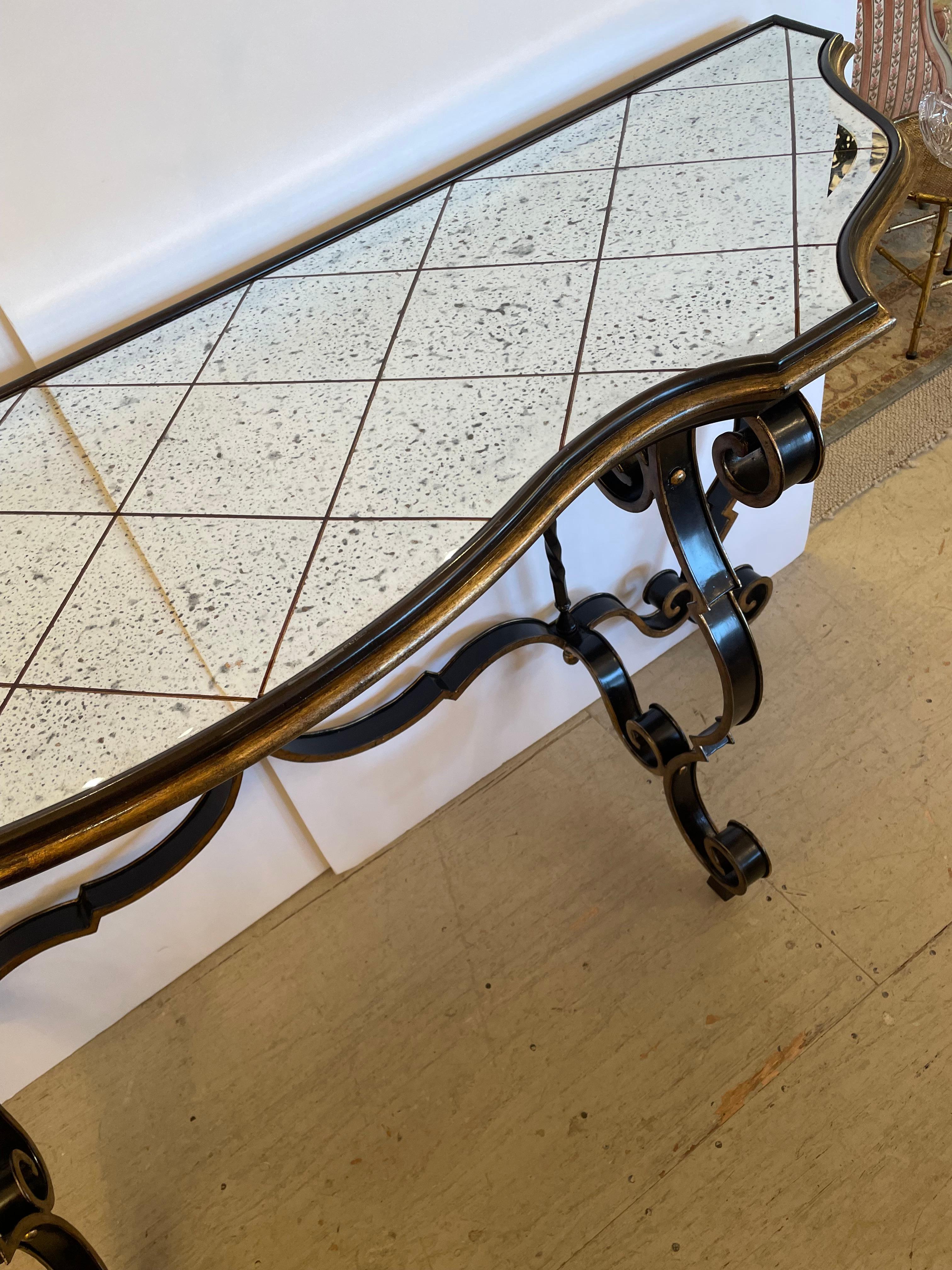 Glamorous Large Black & Gold Hollywood Regency Iron Console with Aged Mirror Top In Good Condition For Sale In Hopewell, NJ