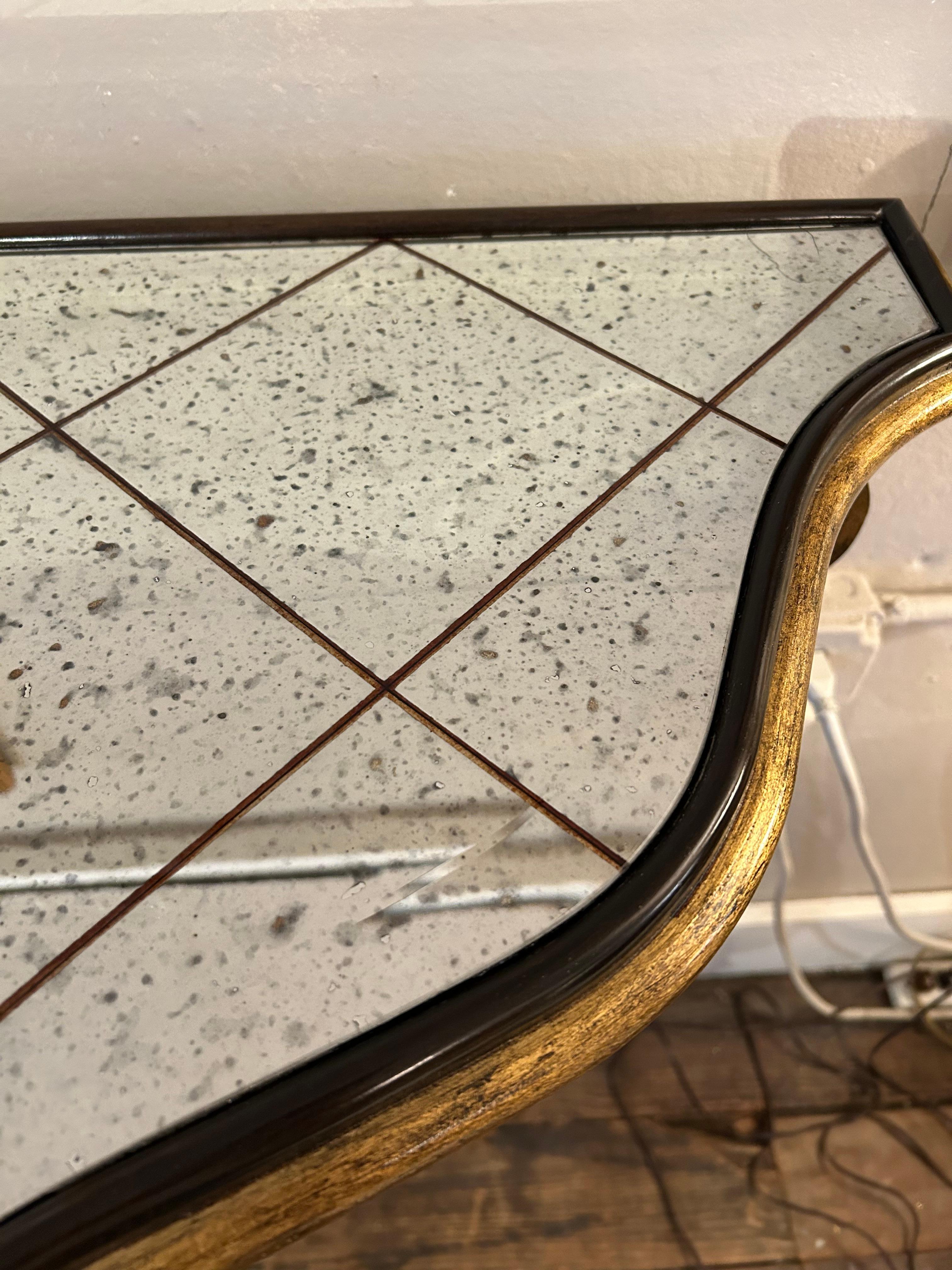 Glamorous Large Black & Gold Hollywood Regency Iron Console with Aged Mirror Top For Sale 4