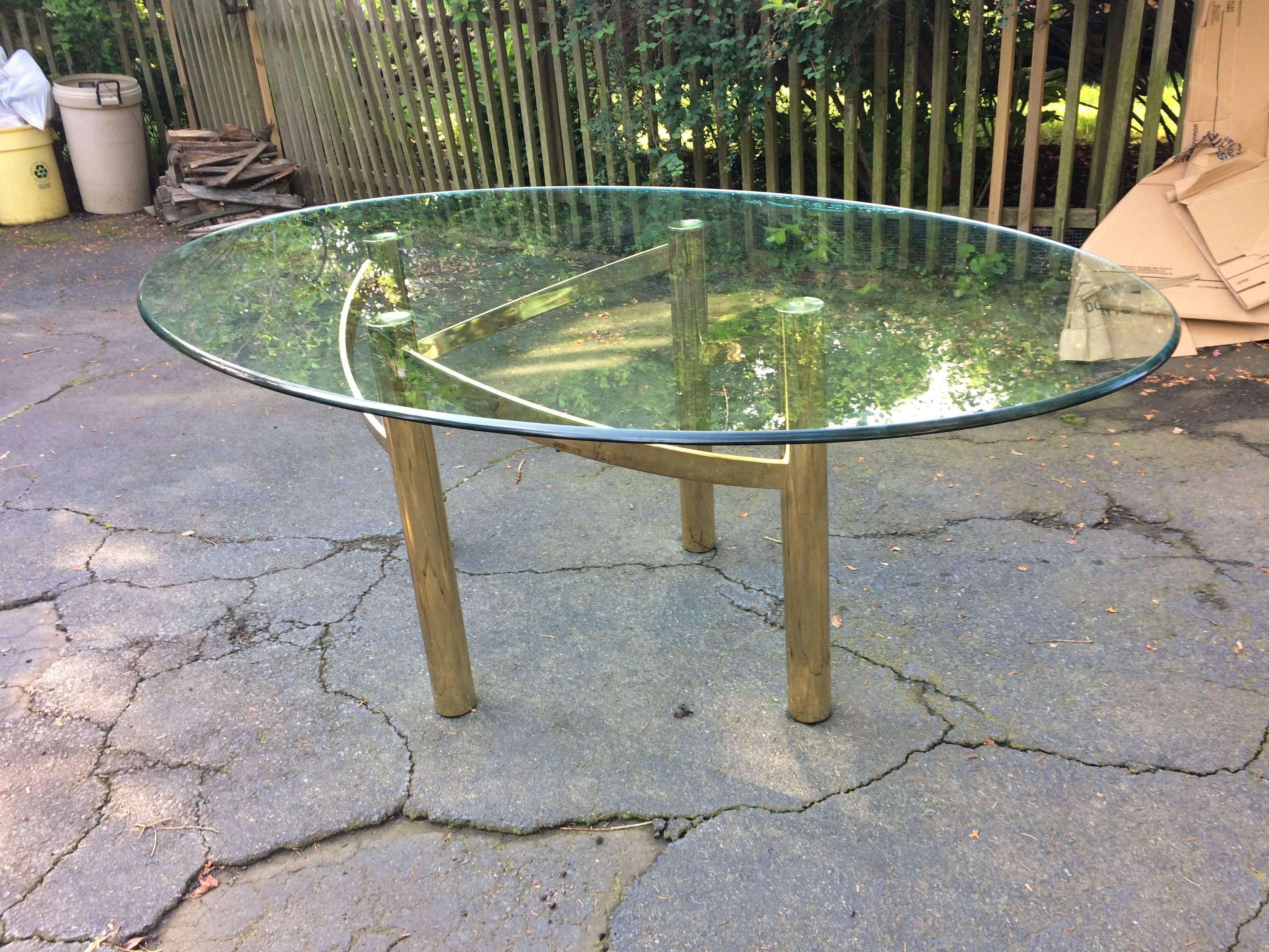 Stunning brass asymmetrical table base purchased about 20 years ago from a high end contemporary furniture store in Oregon. Comes with heavy bevelled oval top, in great condition for it's age.
    