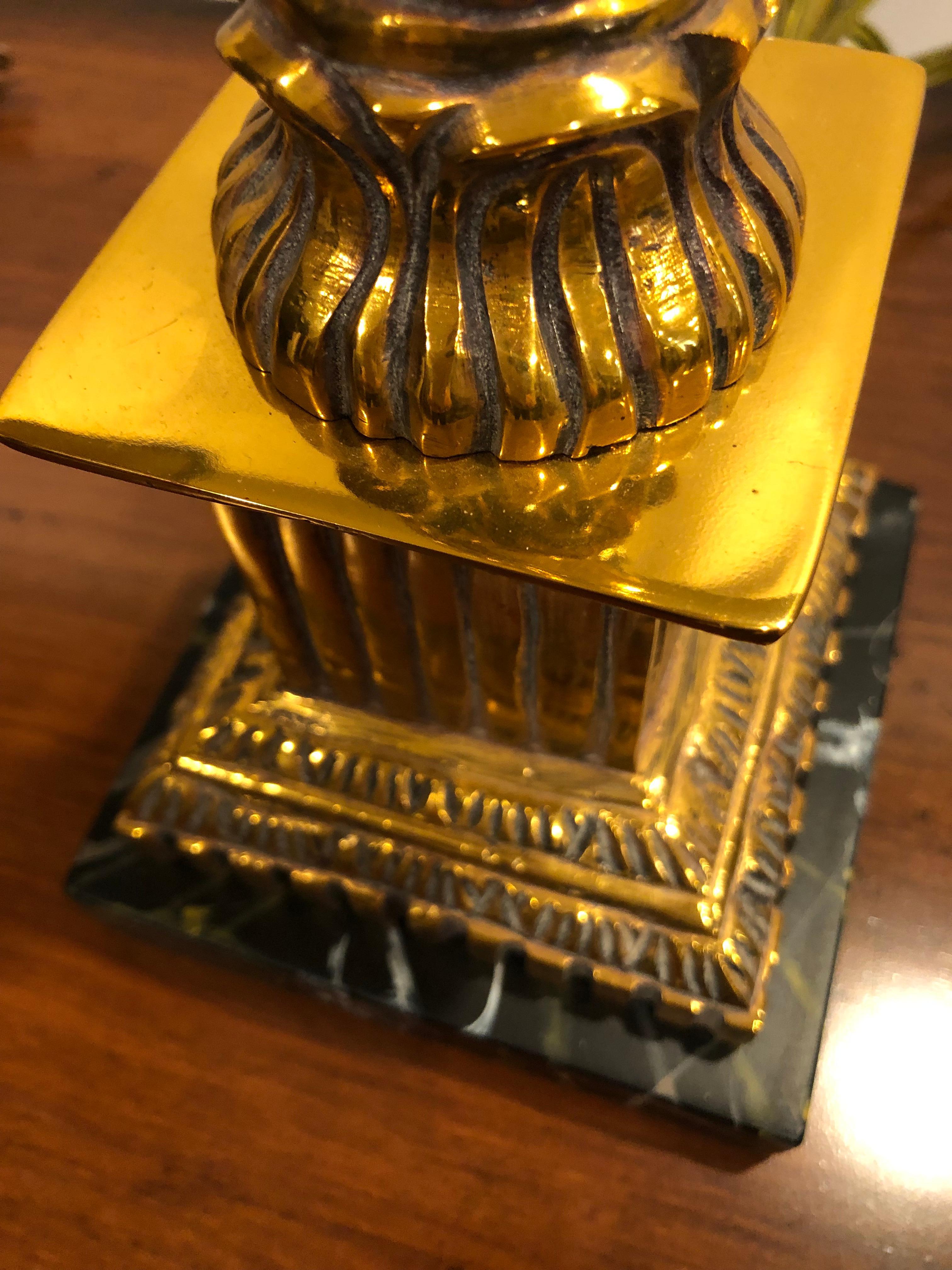 Glamorous glistening warm coppery colored brass table lamps in the shape of neoclassical columns that rest on black marble 4.5 square bases. Custom textured fabric lampshades are a great elegant complement.