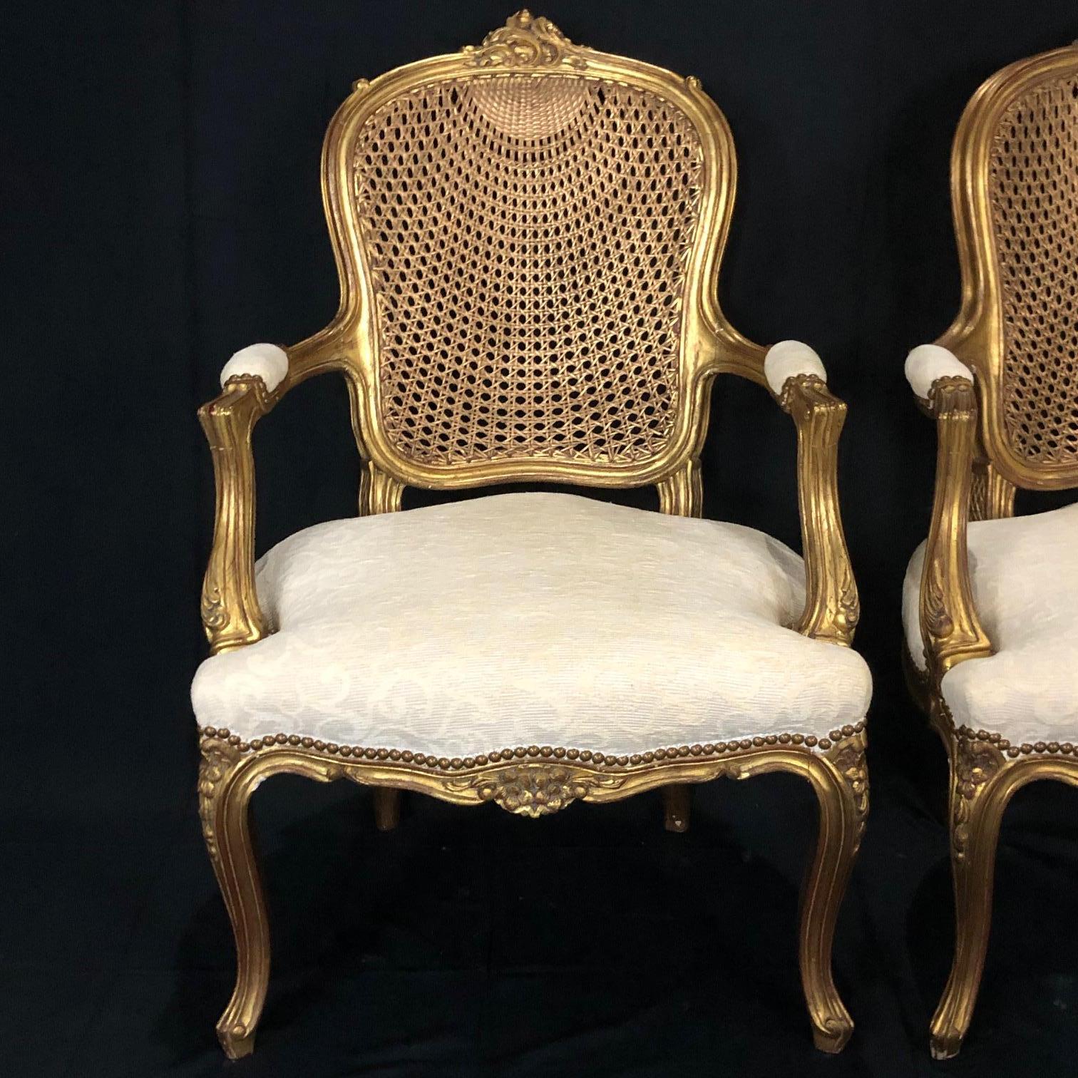 Glamorous Pair of French Louis XV Style Gold Gilt Caned Bergères Armchairs In Good Condition In Hopewell, NJ