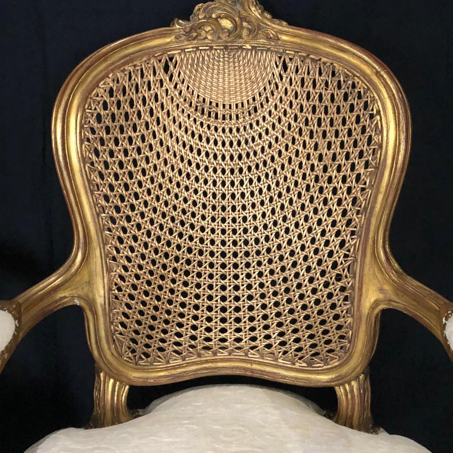 Mid-20th Century Glamorous Pair of French Louis XV Style Gold Gilt Caned Bergères Armchairs