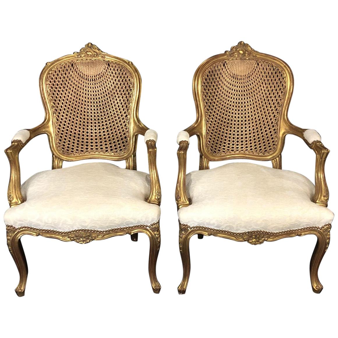 Glamorous Pair of French Louis XV Style Gold Gilt Caned Bergères Armchairs