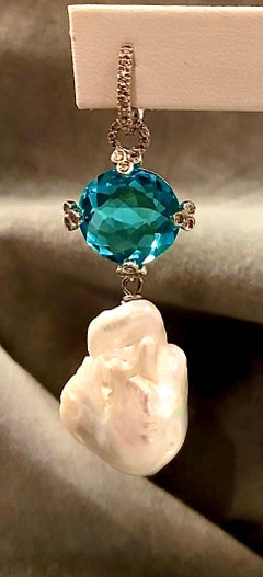 Glamorous pair of pave set earrings with brilliant white diamonds