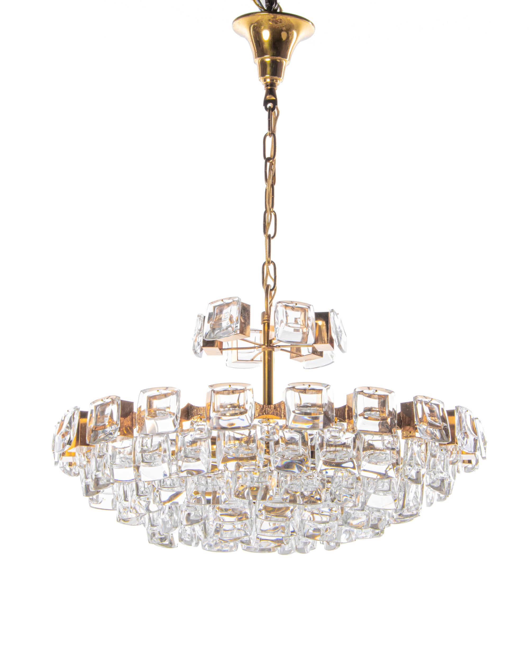 Elegant large chandelier with jewel crystals on a gilt-brass frame. 

The sparkling and glittering Palwa chandeliers are hanging in the Residence of the Empress Marie-Therese of Austria, in the Sultan of Brunei’s palaces, in the palaces of the Kings