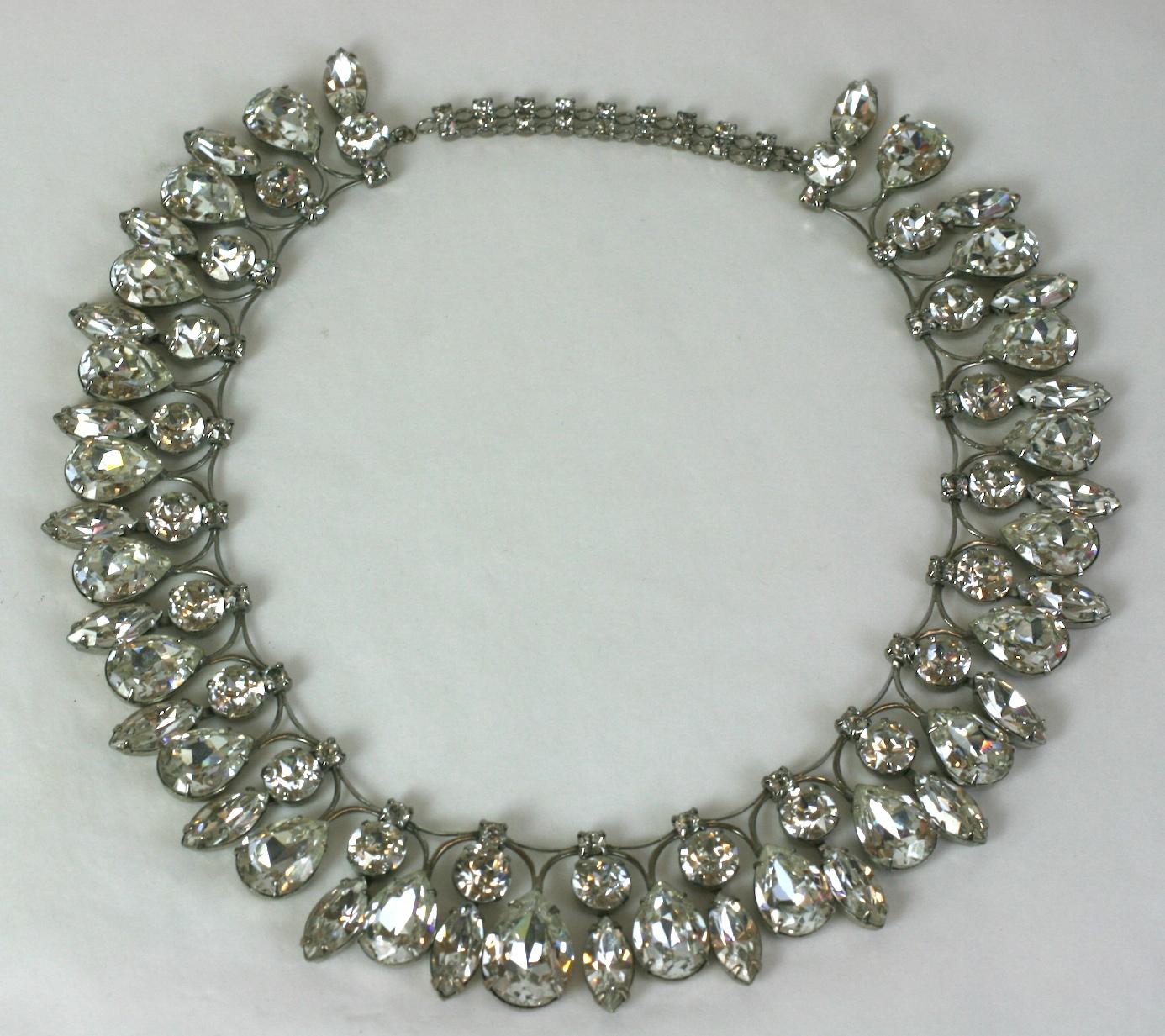 Glamorous Pear Shaped Rhinestone Suite from the 1950's. High quality manufacture with the knife edge settings which let the stones shine. The navette stones are set so they tremble with wearer on necklace and bracelet. 
1950's USA, likely made by