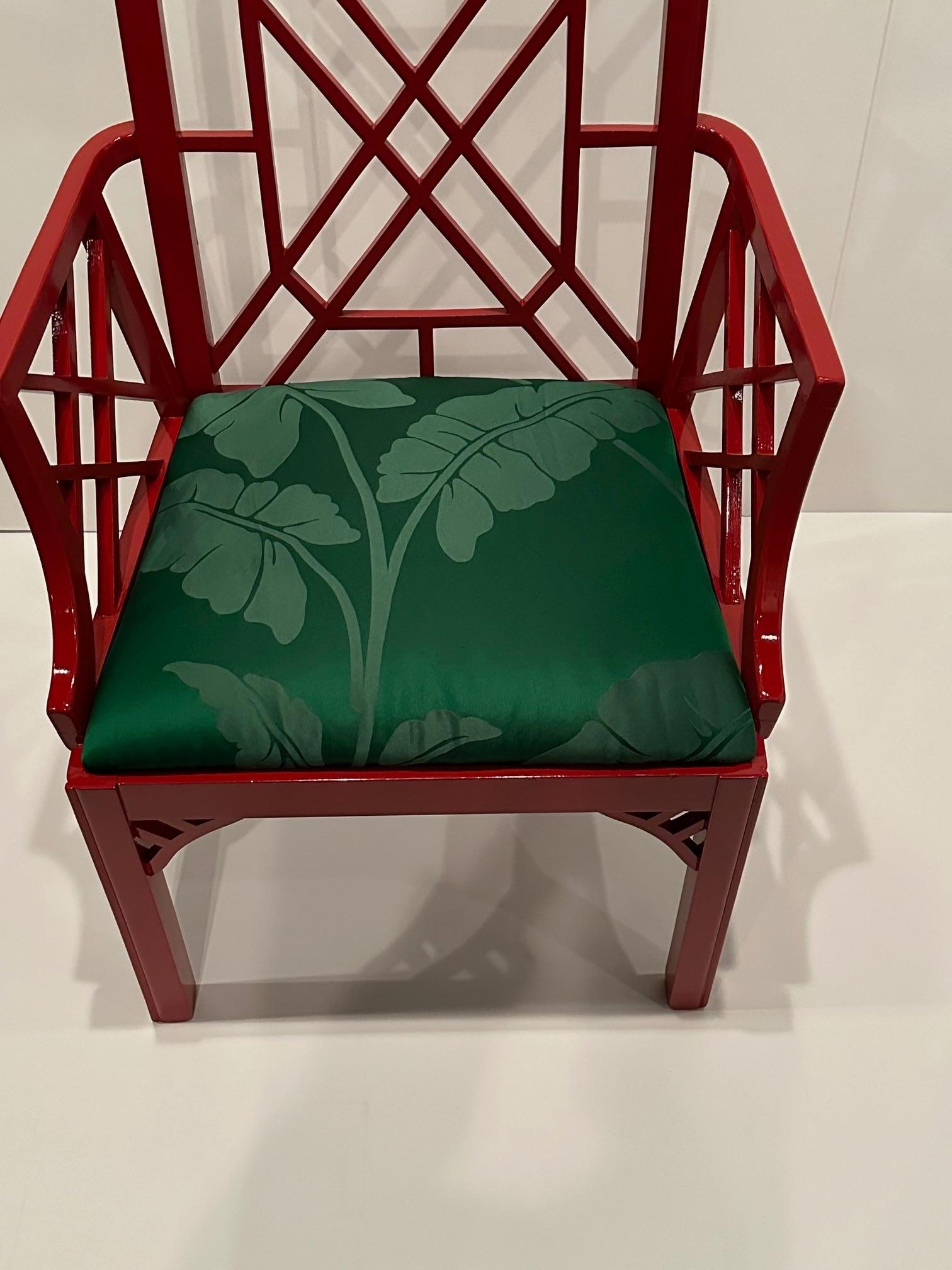 Glamorous Chinese Chippendale style red lacquer armchair having contrasting green silk seat upholstery with palm tree motif.
Arm height 27.5