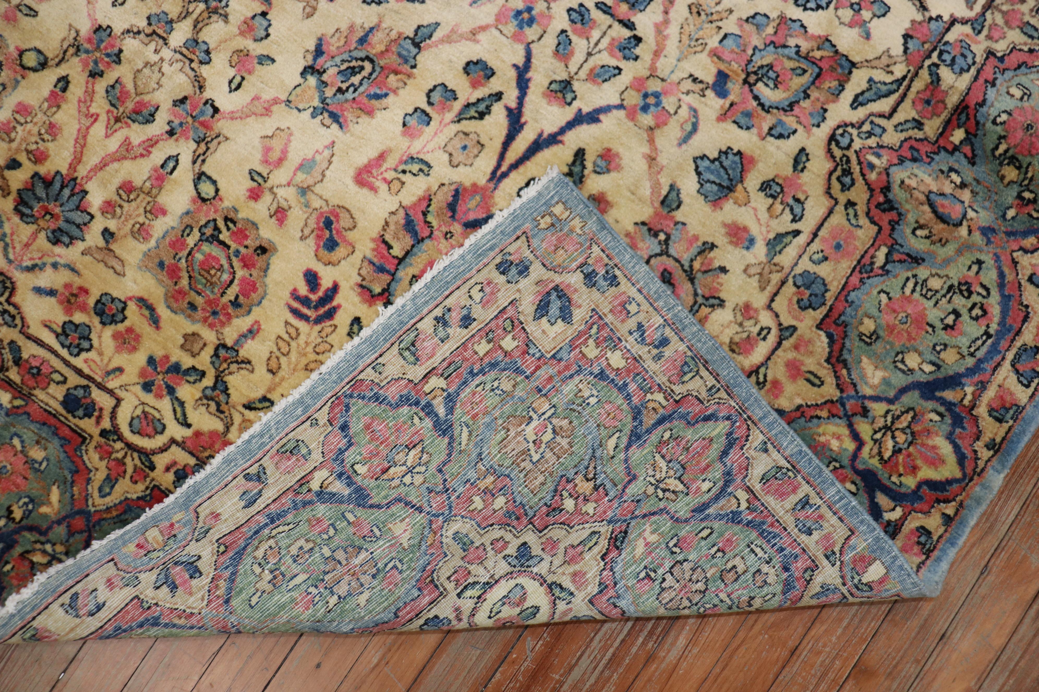 An early 20th century Kerman rug with a floral design on an ivory field in a rare 6 x 9 size. They typically made these in oversize or room size formats

Measures: 6'2” x 9'1”.