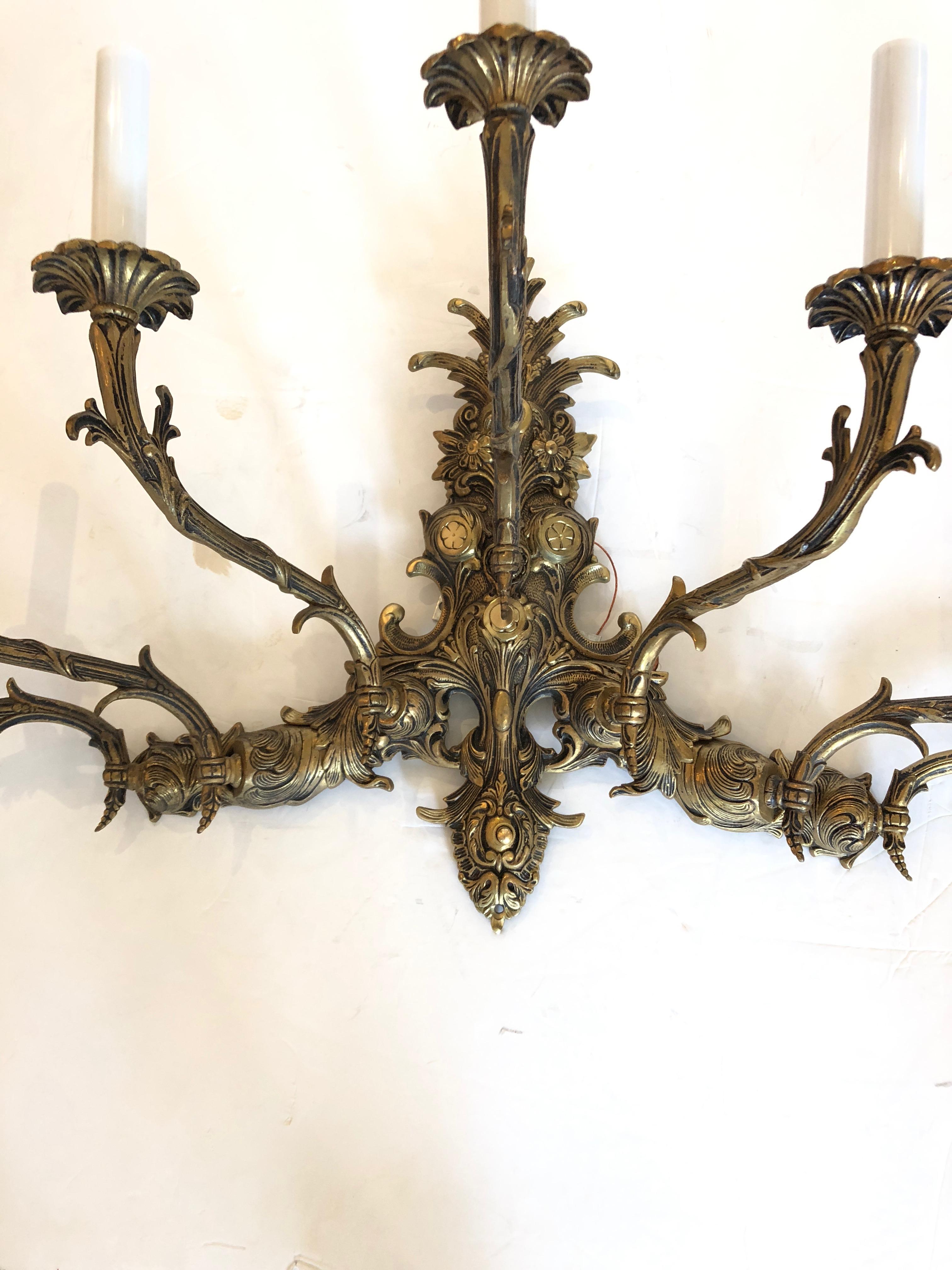 Beautiful ornately carved large vintage wall sconce from Spain having 7 candelabra arms, newly wired and ready to install.
