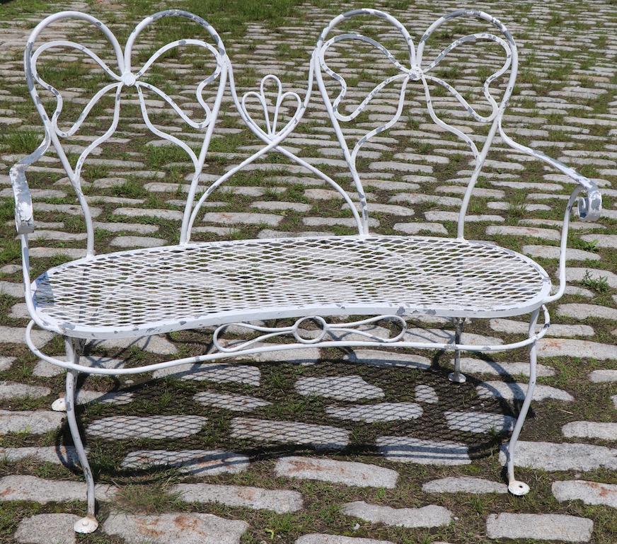 Glamorous Wrought Iron Garden Bench with Bow Tie Back 4
