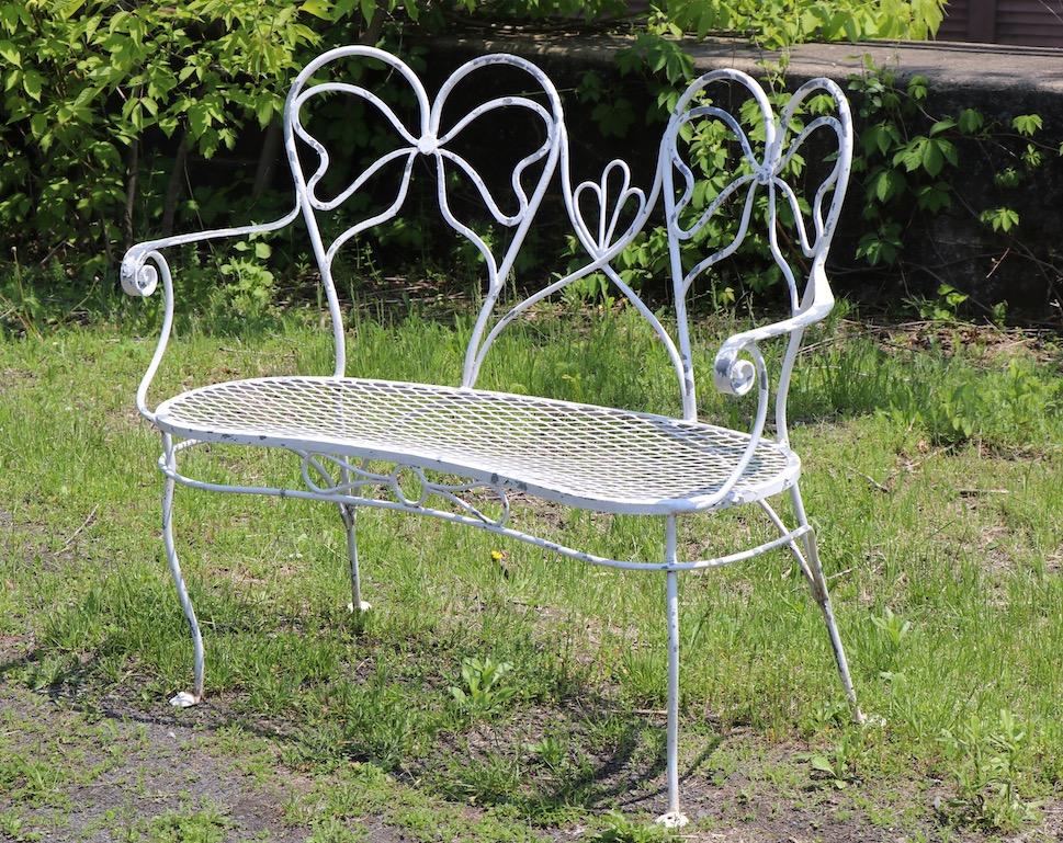 Glamorous Wrought Iron Garden Bench with Bow Tie Back 6