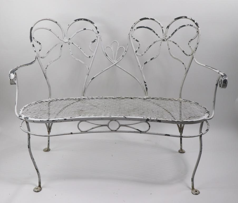 Glamorous Wrought Iron Garden Bench with Bow Tie Back 7