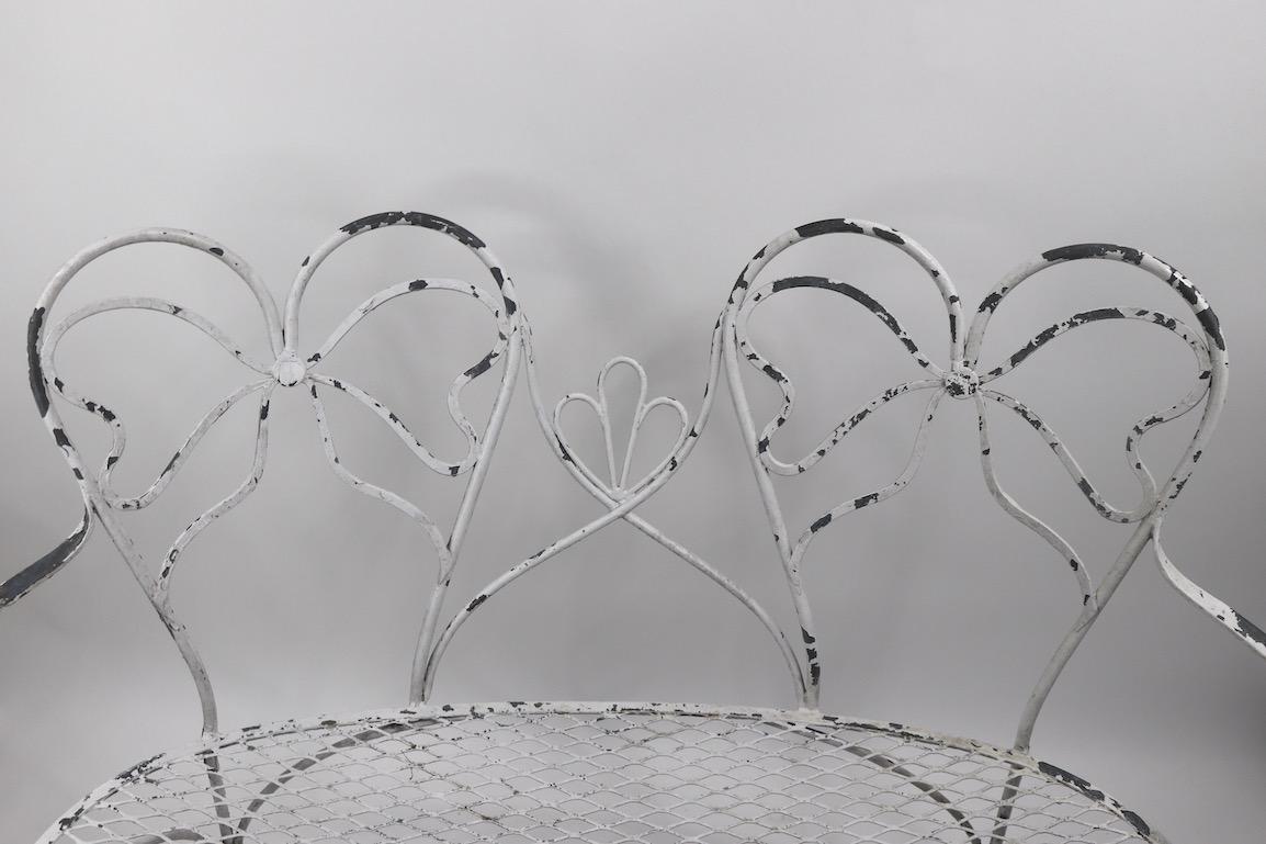 Glamorous Wrought Iron Garden Bench with Bow Tie Back 8