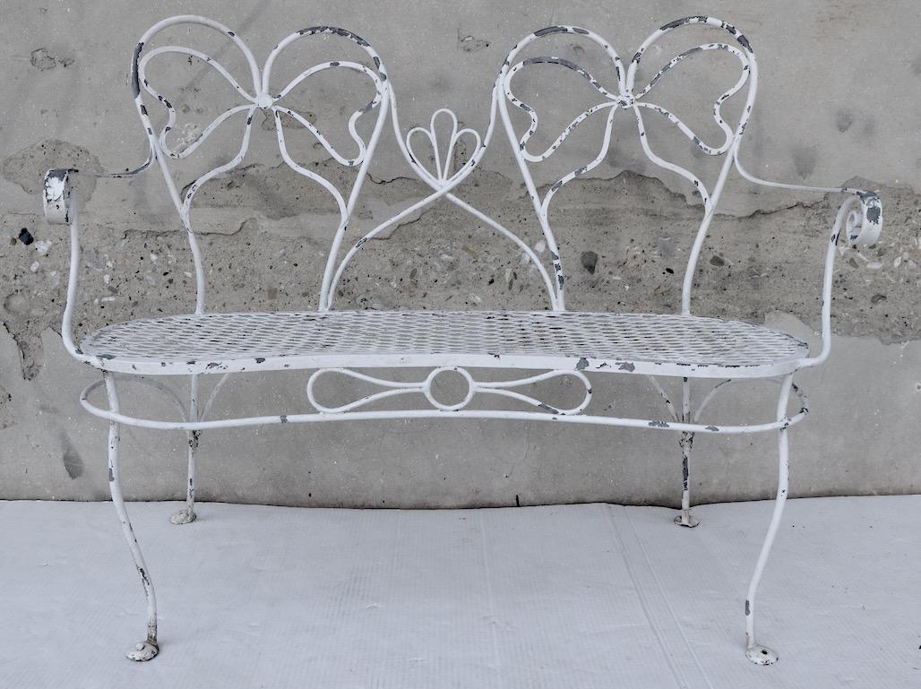 Glamorous Wrought Iron Garden Bench with Bow Tie Back 1
