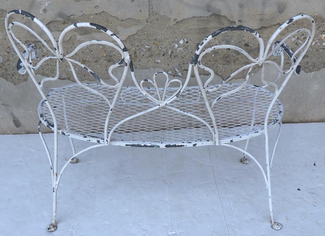 Glamorous Wrought Iron Garden Bench with Bow Tie Back 3