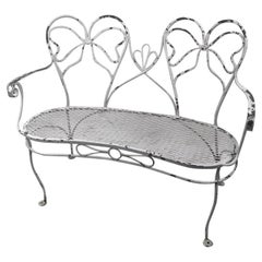 Glamorous Wrought Iron Garden Bench with Bow Tie Back