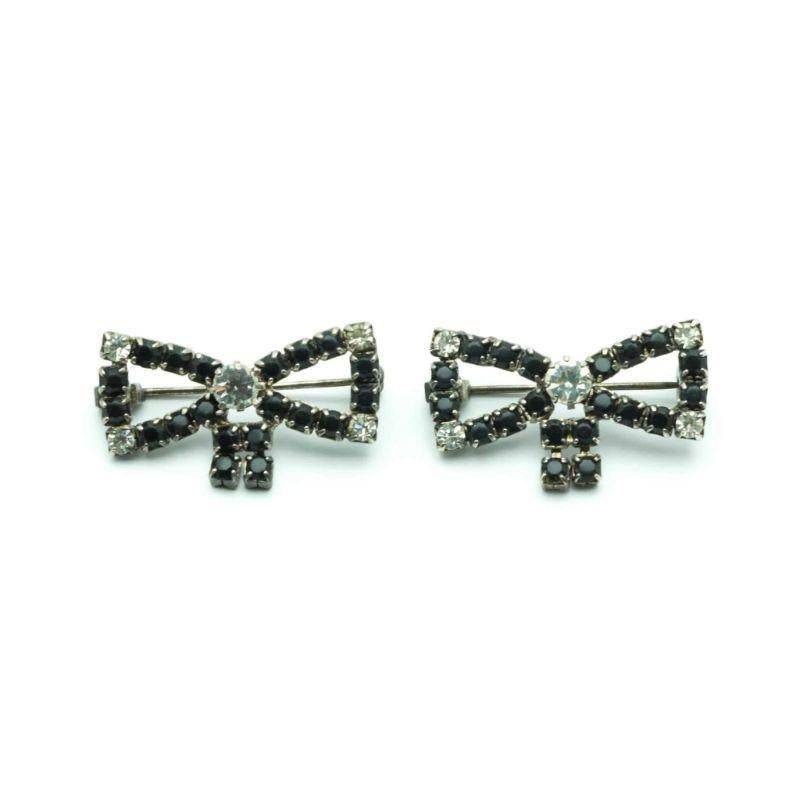 Very Pretty & glamour Vintage pair of brooches: black and white crystal bows, blackened sllver metal, can be worn on all your outfits and different ways.

Signature: Unsigned, just unique !!! gorgeous quality
Dimensions: 3.2  x 1.4  cm
Condition: