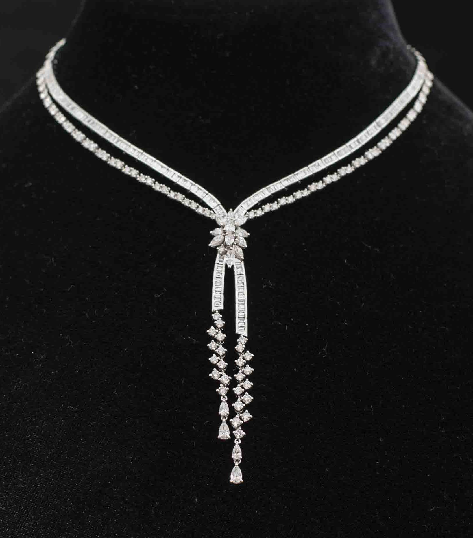 Glamourous  18 Karat White Gold and Diamond Necklace.

Diamonds of approximately 11.531 carats, mounted on 18 karat white gold choker necklace. The Necklace weighs approximately 58 grams.

Please note: The charges specified do not include any