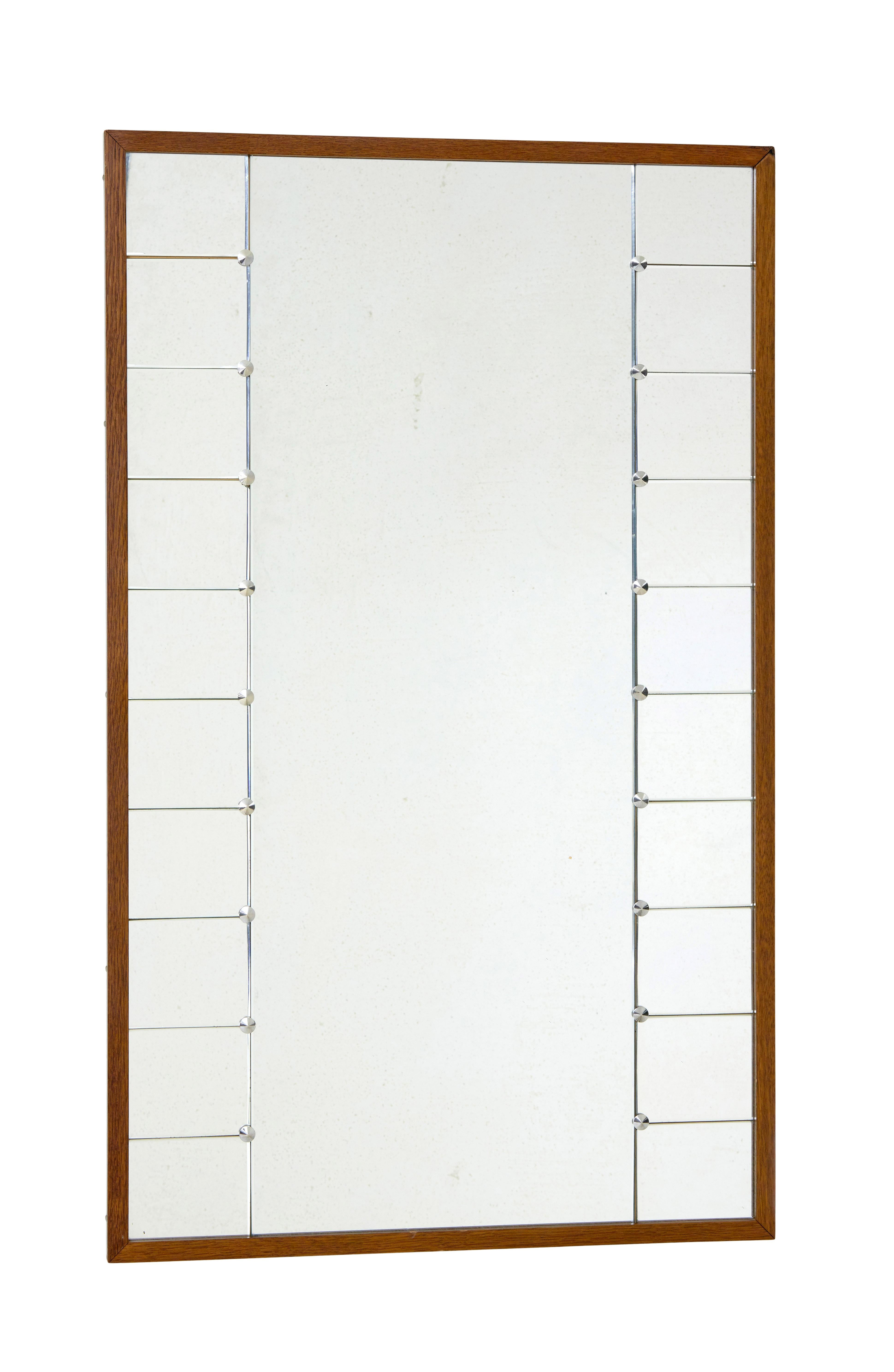 Glas and tra Swedish segmented wall mirror circa 1950.

Good sized mirror ideal for the bedroom, made by well known swedish makers g&t.

Cut and beveled rectangular mirror sections that flank the main body of the mirror, held in place by chromed