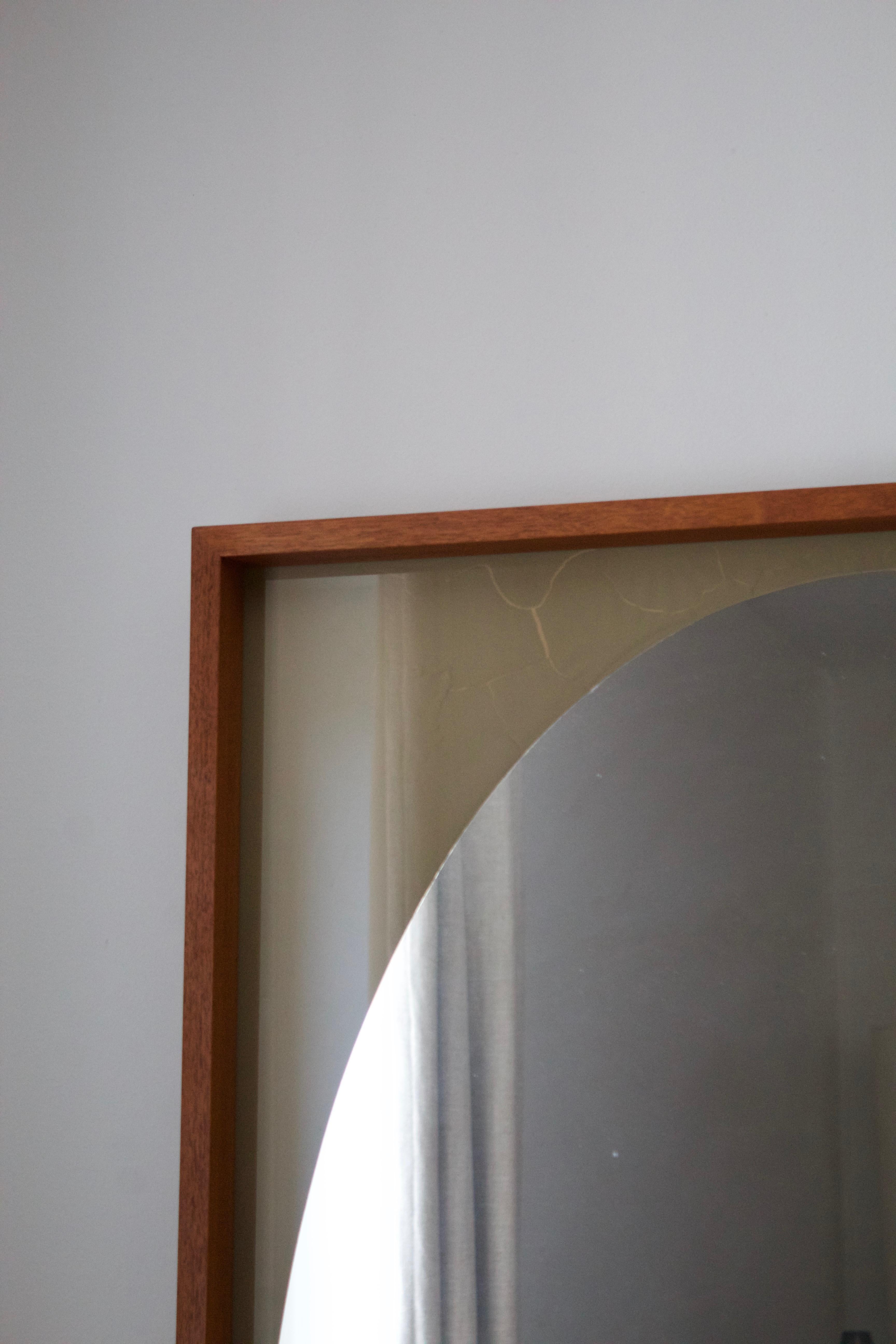 A rare large wall mirror produced by AB Glas & Trä, Hovmantorp, Sweden. Crystal mirror glass with original painted vignette. Oiled walnut frame. With original label.

Other designers of the period working in the organic style include Fontana Arte,