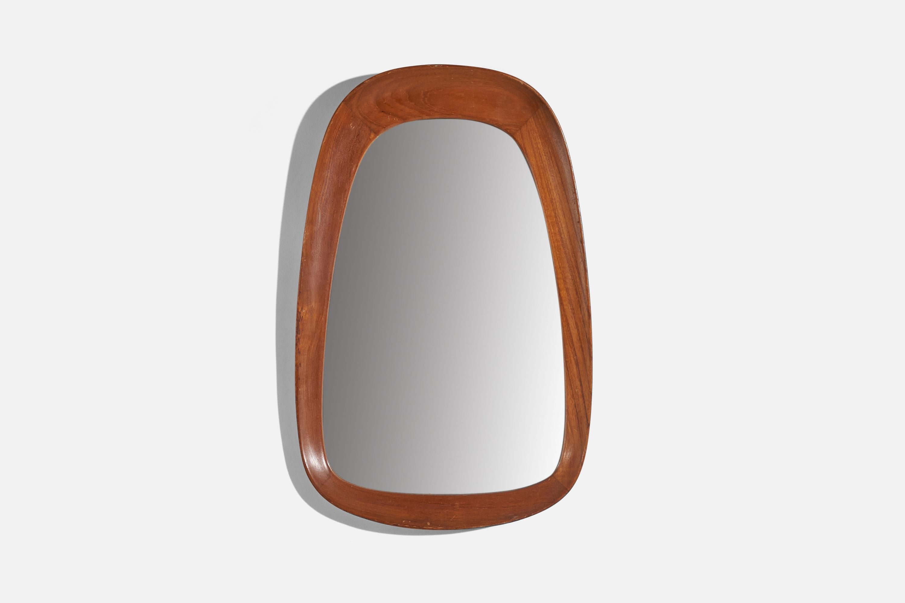 A teak and crystal glass wall mirror designed and produced by AB Glas & Trä, Hovmantorp, Sweden, 1950s. 