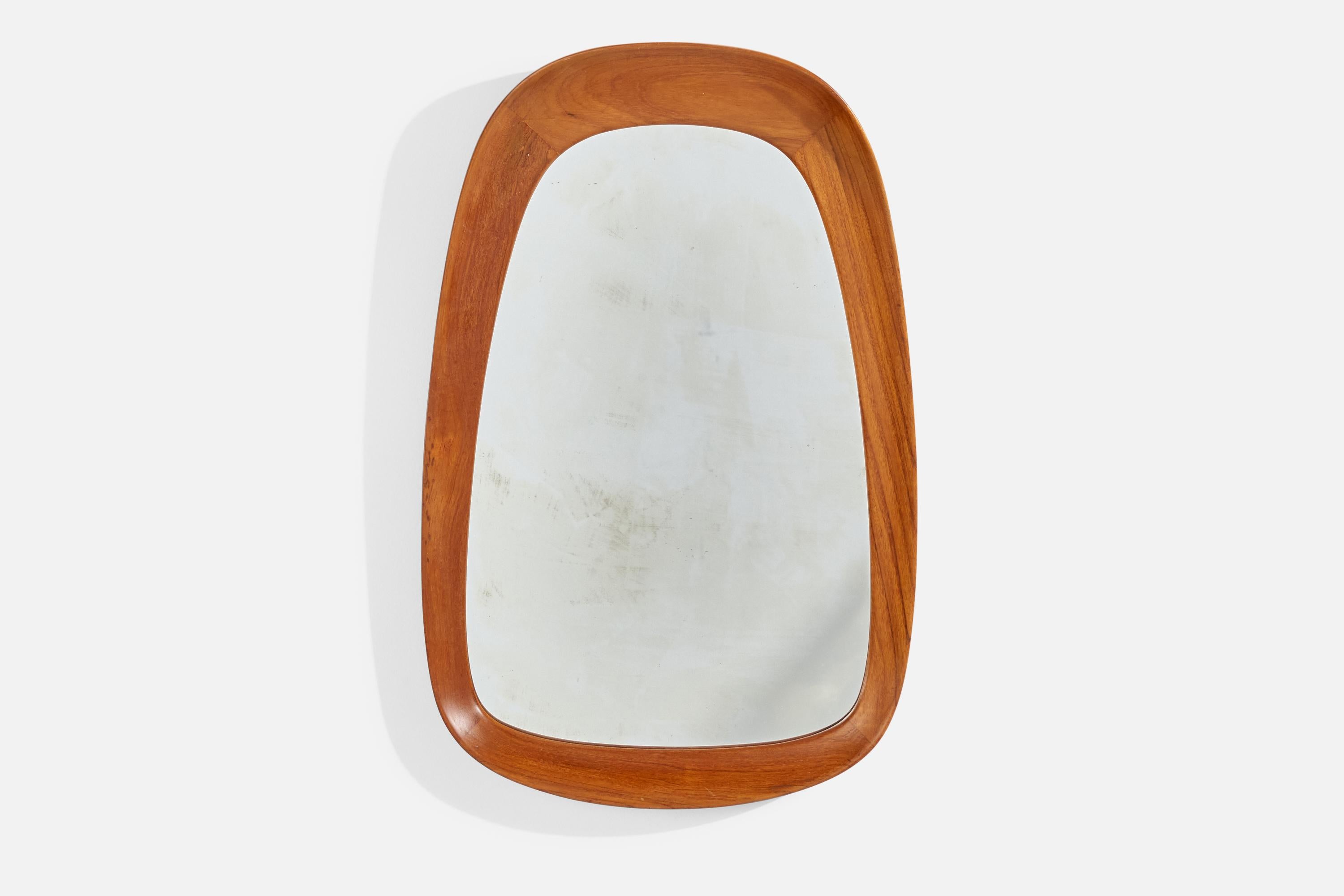 A teak and crystal glass wall mirror designed and produced by AB Glas & Trä, Hovmantorp, Sweden, 1950s. 