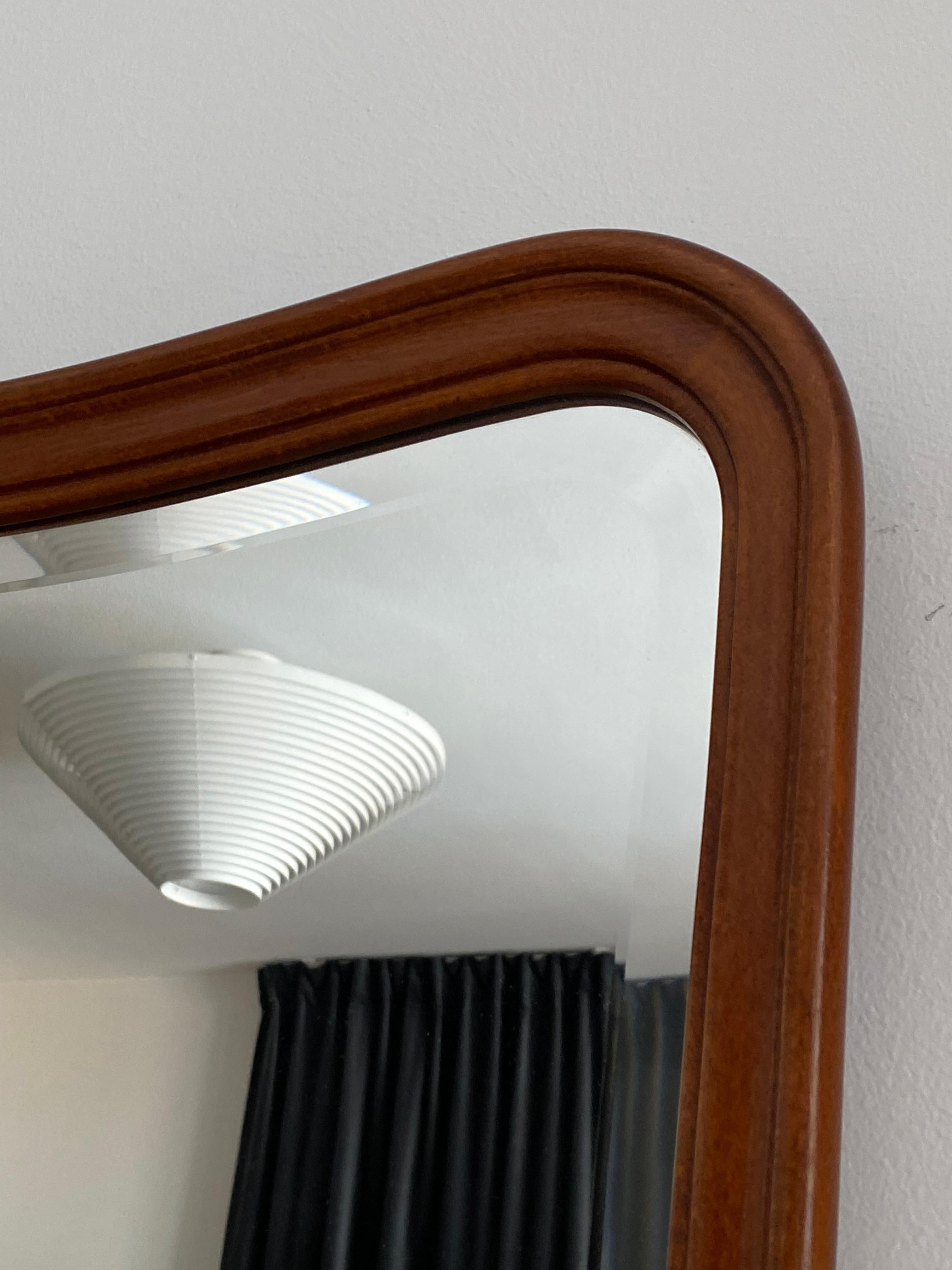 A rare organic wall mirror produced by AB Glas & Trä, Hovmantorp, Sweden. In sculpted teak and crystal mirror glass, labeled. 

Other designers of the period working in the organic style include Fontana Arte, Gio Ponti, and Paolo Buffa.