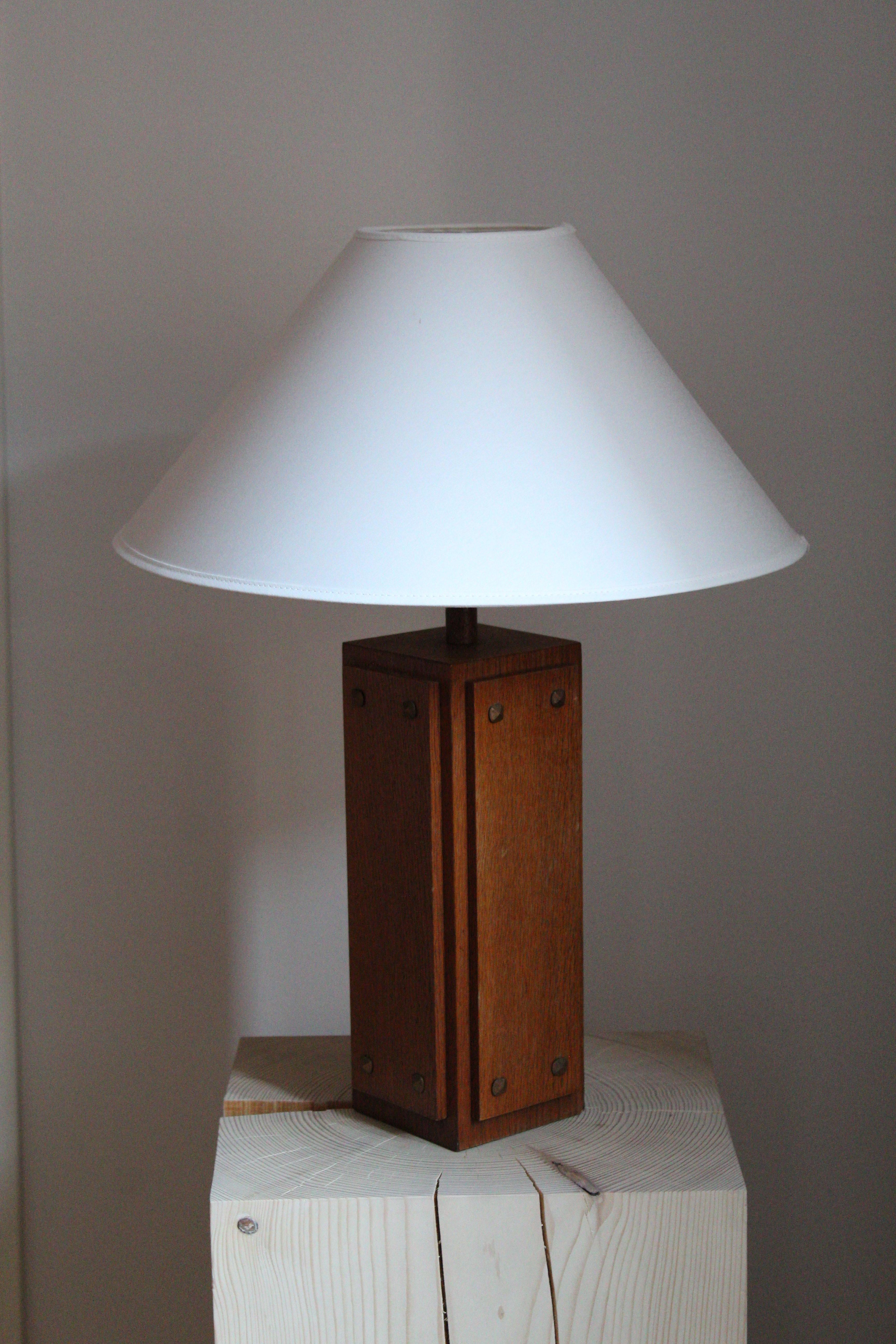 A rare sizable table lamp produced by AB Glas & Trä, Hovmantorp, Sweden. In teak with brass nails. Labeled.

Sold excluding lampshade, stated dimensions excluding lampshade.

Other designers of the period working in the organic style include