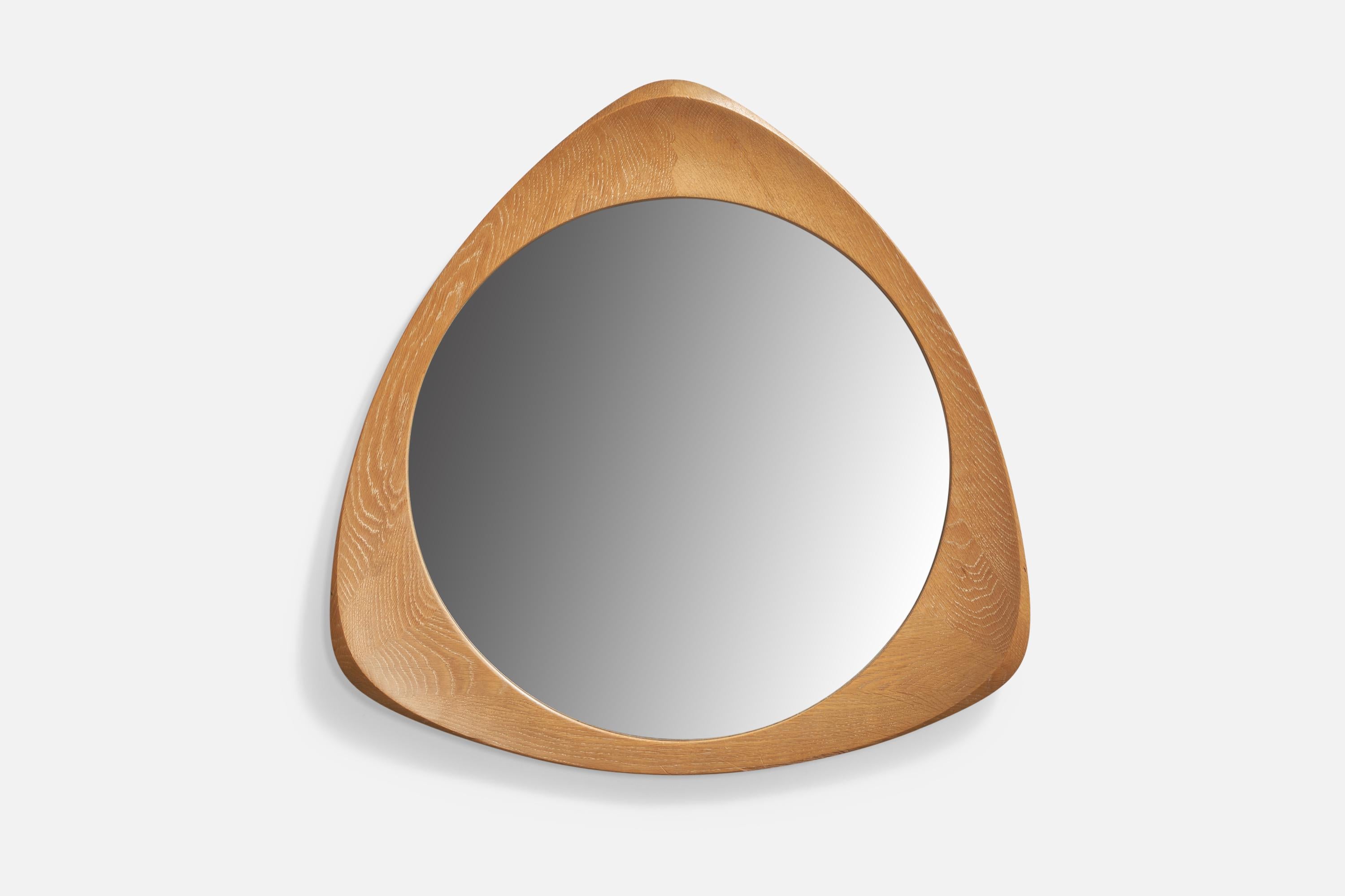 An oak and cristal glass wall mirror designed and produced by Glas & Trä, Hovmantorp, Sweden, 1960s.