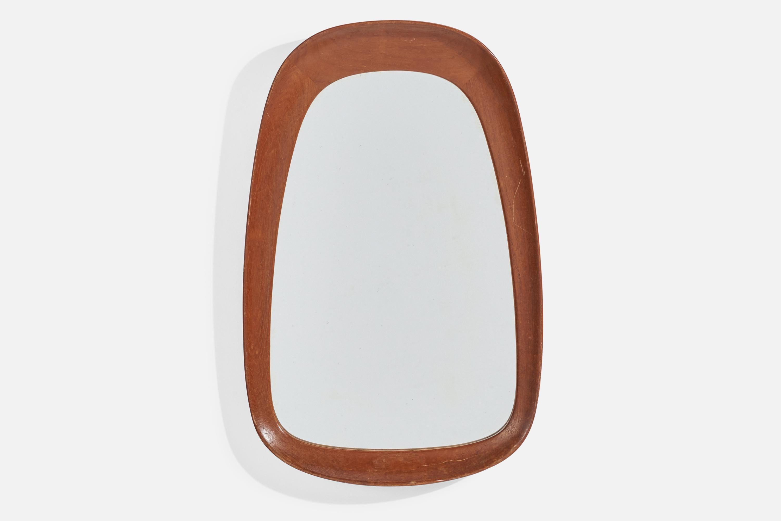 A teak and crystal glass wall mirror designed and produced by AB Glas & Trä, Hovmantorp, Sweden, 1950s. 