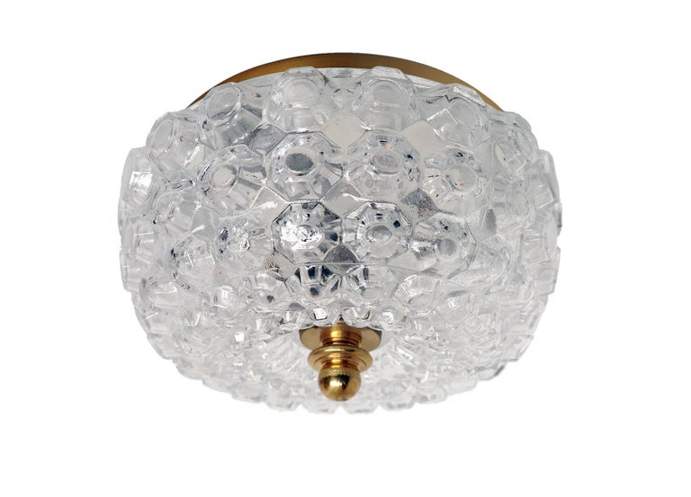 Elegant modernist flush mount ceiling light and wall sconce made of clear, thick and textured glass dome on a brass frame designed by Helena Tynell attr. Manufactured by Glashutte Limburg, Germany in the 1960s. 

Design: Helena Tynell attr. 
Style: