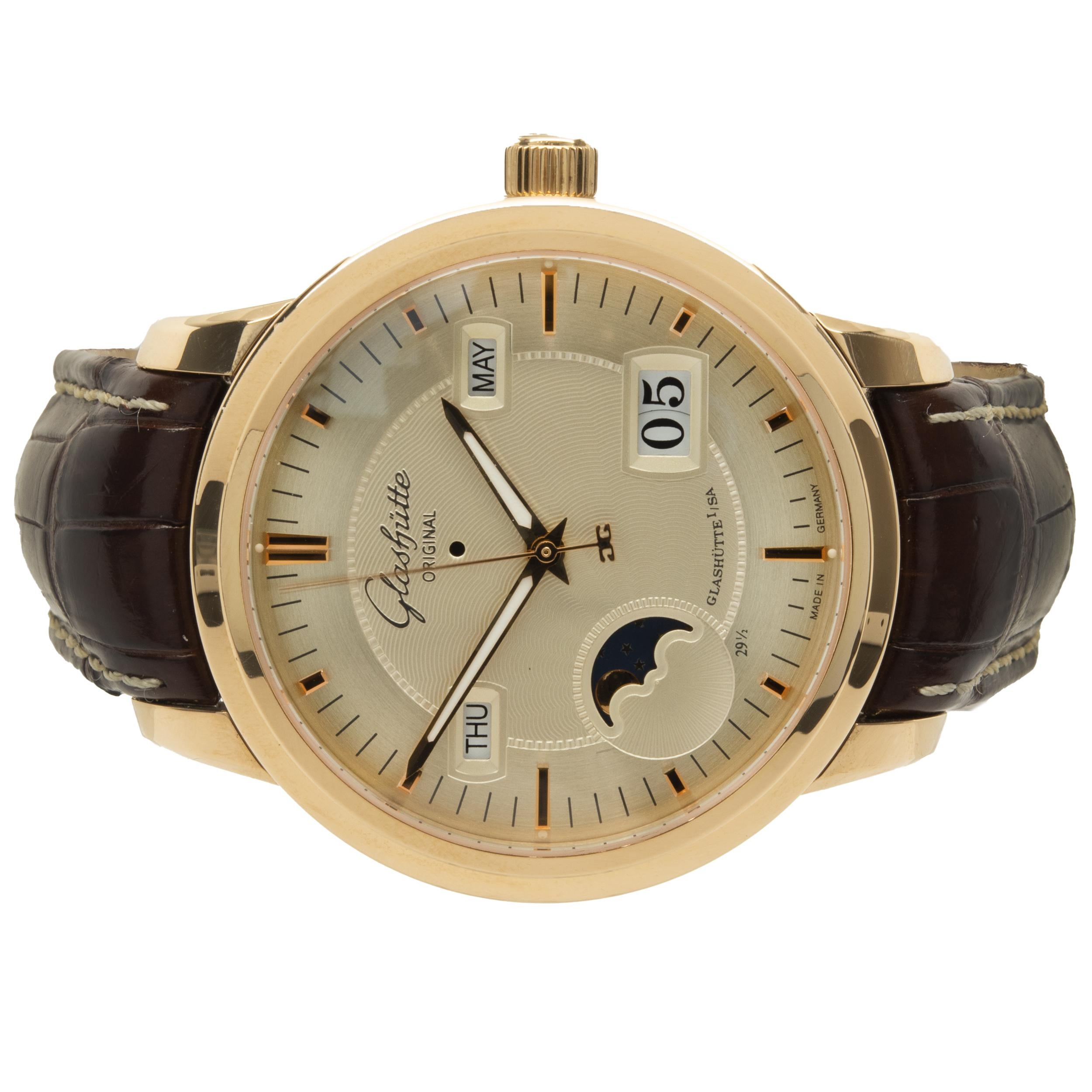 Movement: automatic
Function: hours, minutes, seconds, day, date, month, moon phase, perpetual calendar
Case: 40mm 18K yellow gold, push pull crown, sapphire crystal, smooth bezel
Dial: champagne stick dial, sword sweeping hands
Band: Glashutte