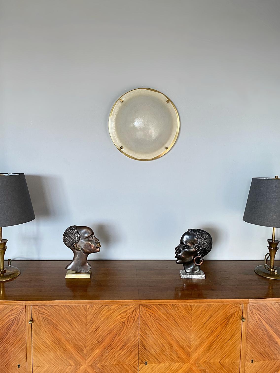 Iconic midcentury lamp made by Glashütte Limburg in the late 1970s. It's featuring thick Murano domed ice glass and polished brass hardware. It's in excellent condition with three Edison E27 sockets. It was one of the biggest flush mounts or wall
