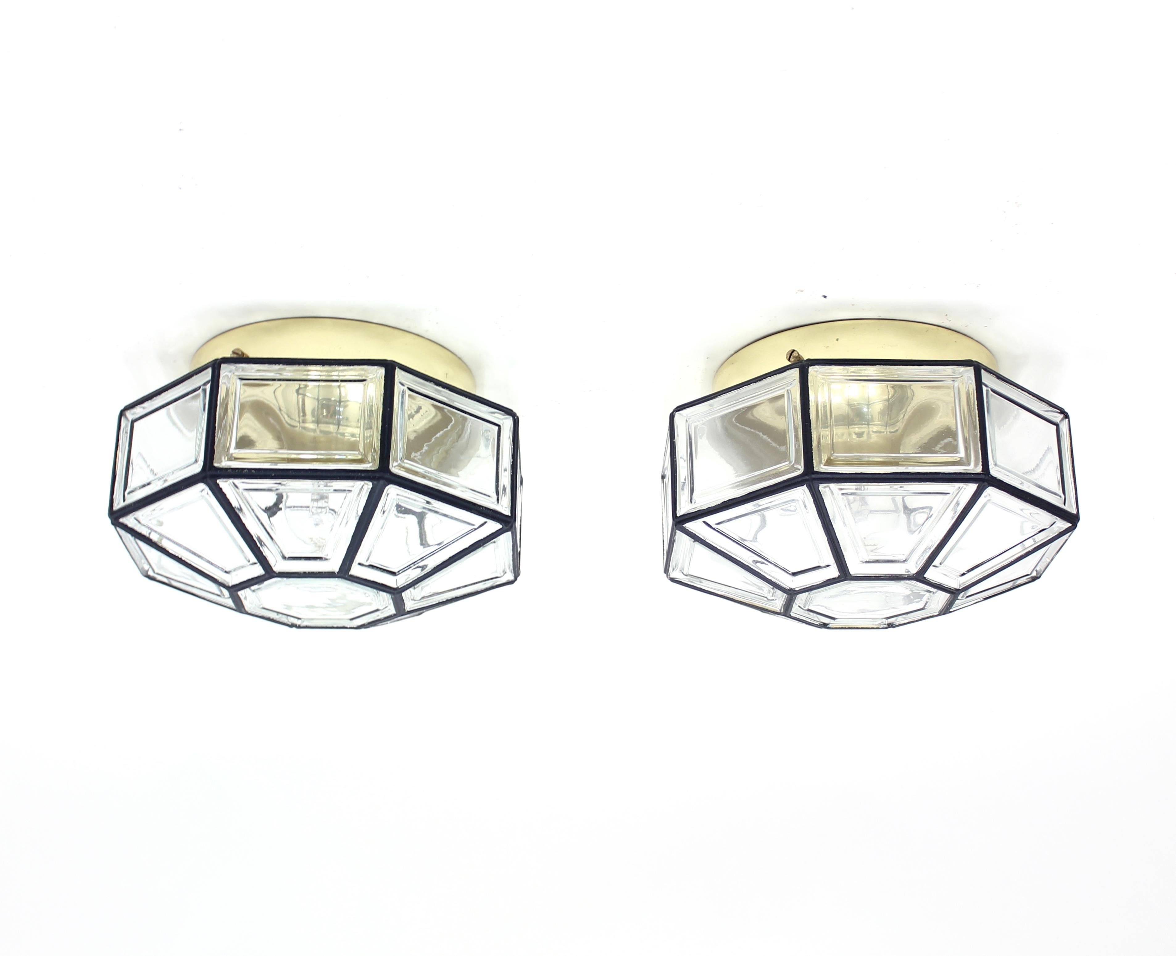 Pair of flush mounted ceiling lamps, model Carat, originally designed by Hans-Agne Jakobsson for his own firm but these examples are made under license by German manufacturer Glashütte Limburg and are made of brass and glass. Works both as a