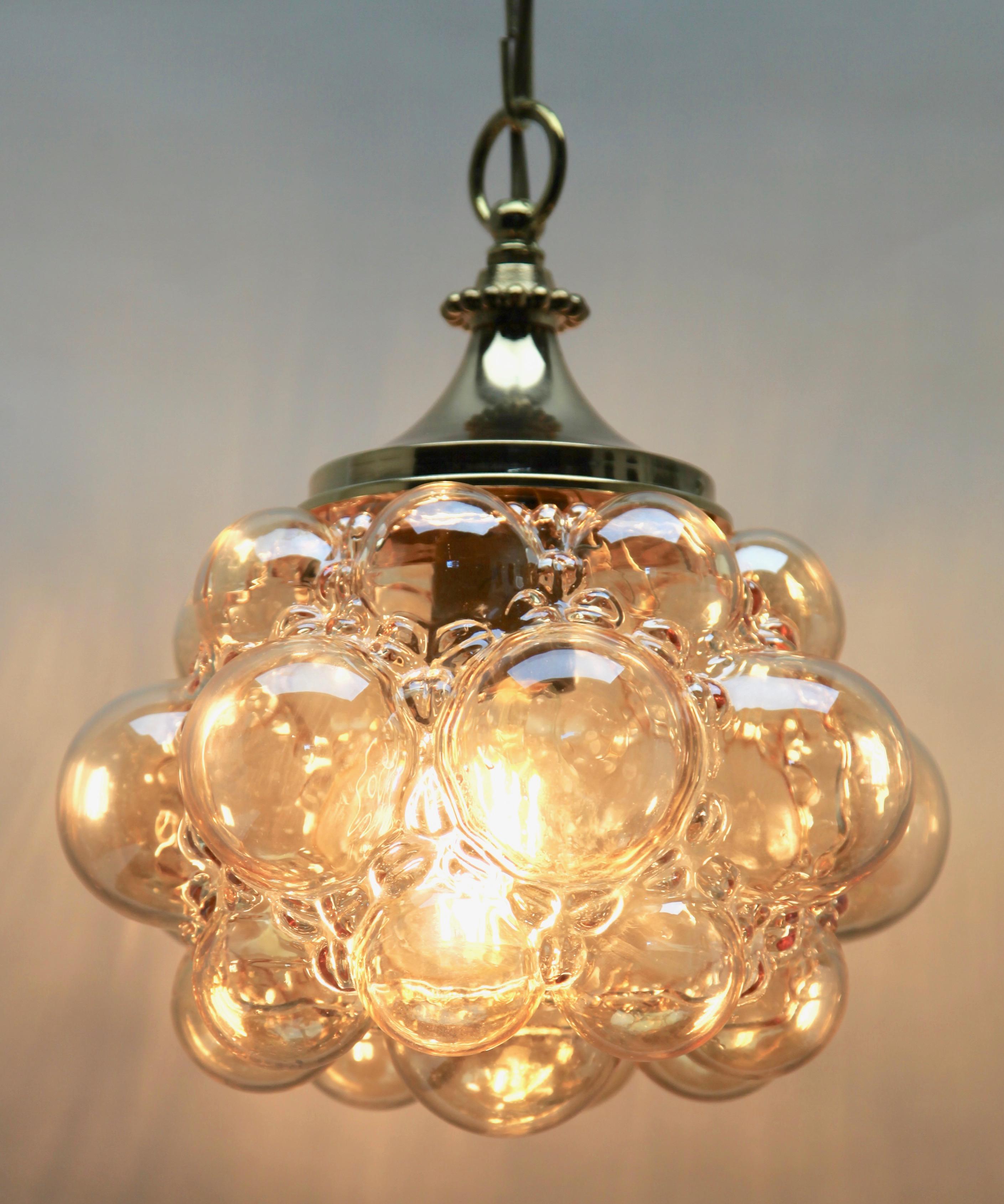 Bubble pendant by Glashütte Limburg during Helena Tyrell Era, 1960s

In excellent condition and in full working order having recently been re-wired
With original patina on brass parts.
Lamp total height 22.83 inch
Size: Glass shade height 9.44
