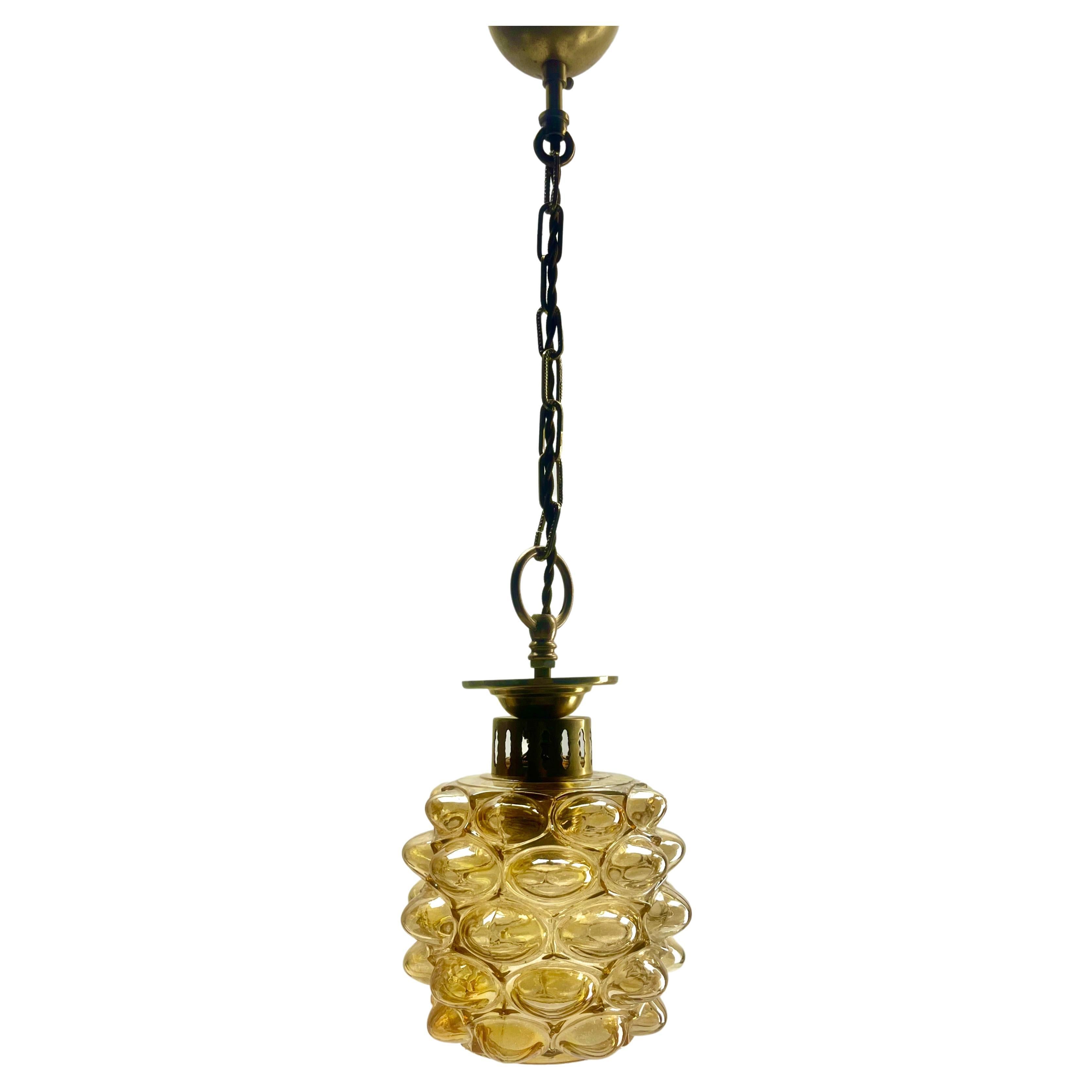 Bubble pendant by Glashütte Limburg during Helena Tyrell Era, 1960s

In excellent condition and in full working order having recently been re-wired and New Fitting E27
With original patina on brass parts.
Lamp total height 60 cm
Size: Glass shade