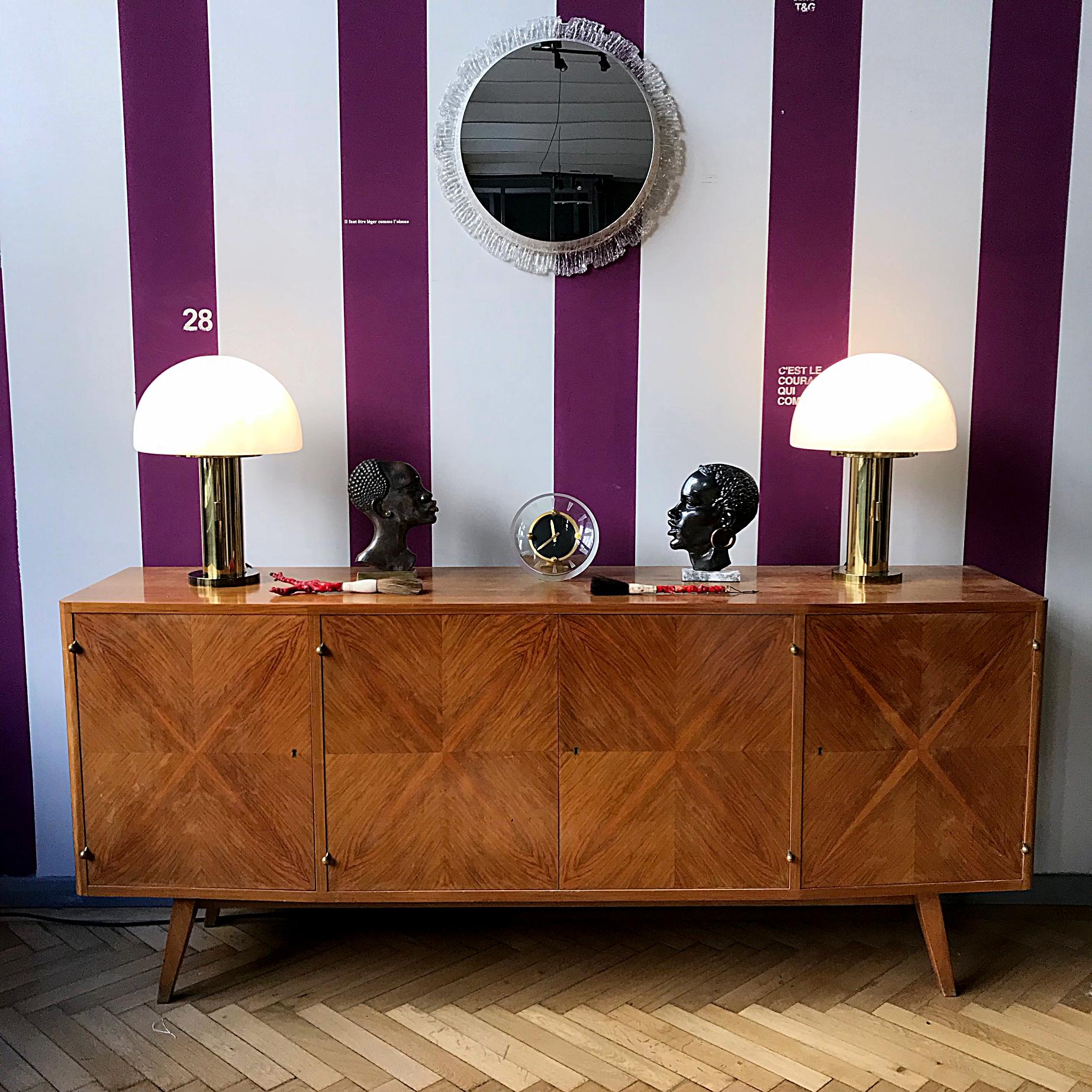 Pair of elegant Space Age sideboard lamps manufactured by Glashütte Limburg in Germany. The lamps are made of brass with the rare mouth-blown lampshade that contain air bubbles providing a smooth and wonderful light. The lamps are in very good