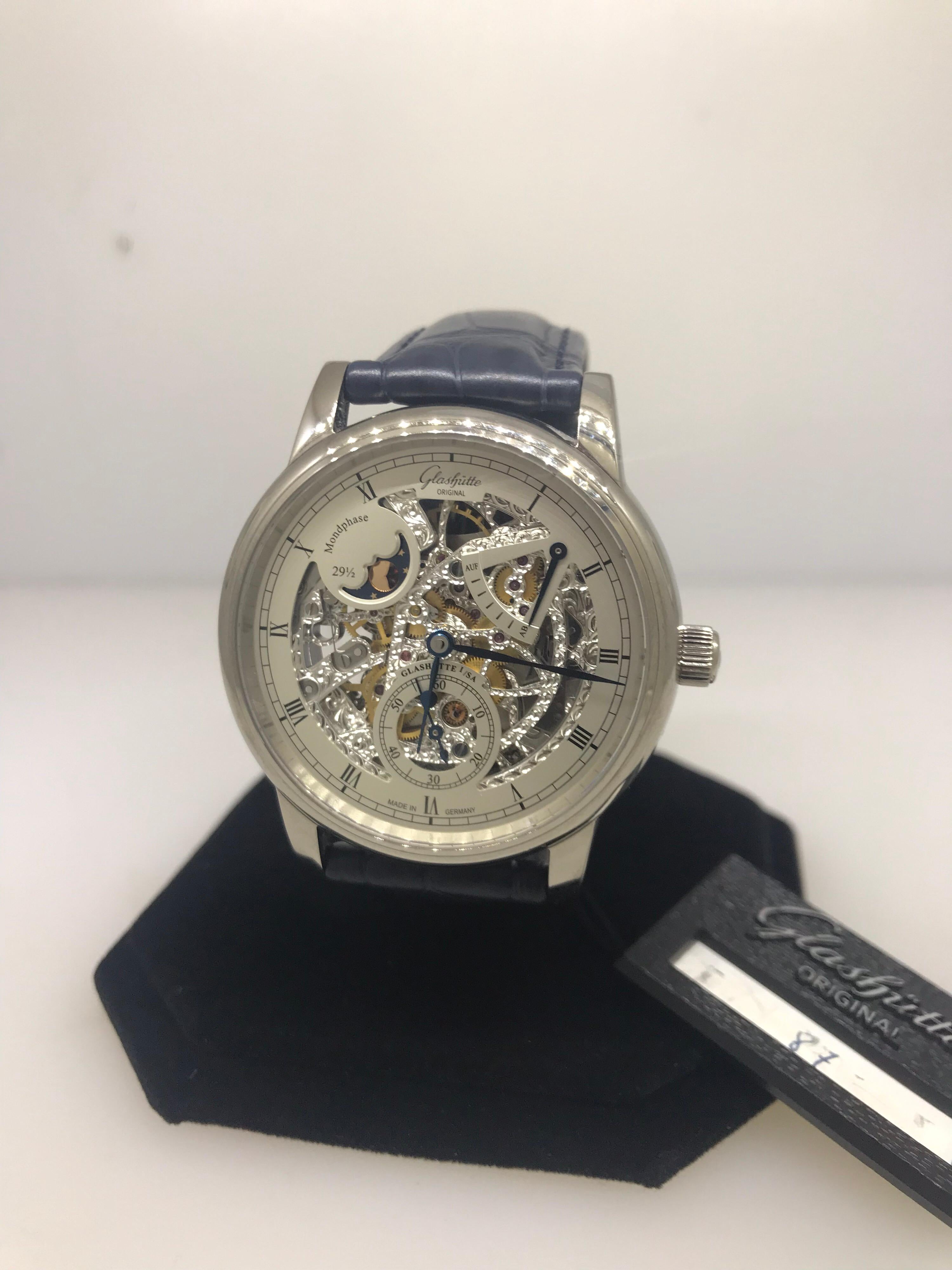 Glashutte Original Senator Moon Phase Skeletonized Edition Men's Watch

Model Number: 1-49-13-15-0430

100% Authentic

Brand New

Comes with original Glashutte Original box and papers

18 Karat White Gold Case

Grey Skeleton Dial

Case Size: