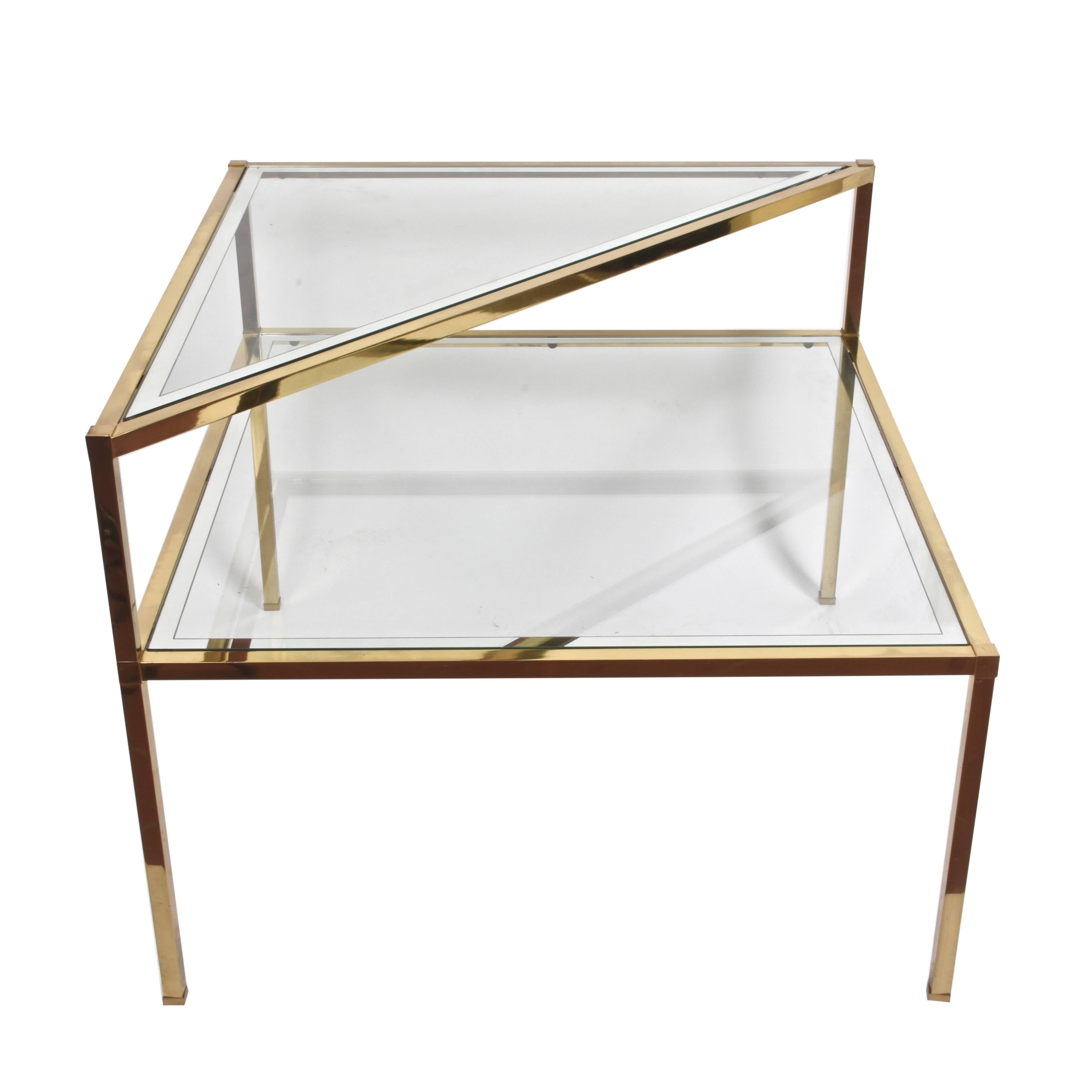 Midcentury pair of two brass cocktail tables with double shelf. This wonderful set was produced in Italy during the 1970s.

The lines and the design of this set of tables are simply unique, the bottom shelf being squared and the top one being