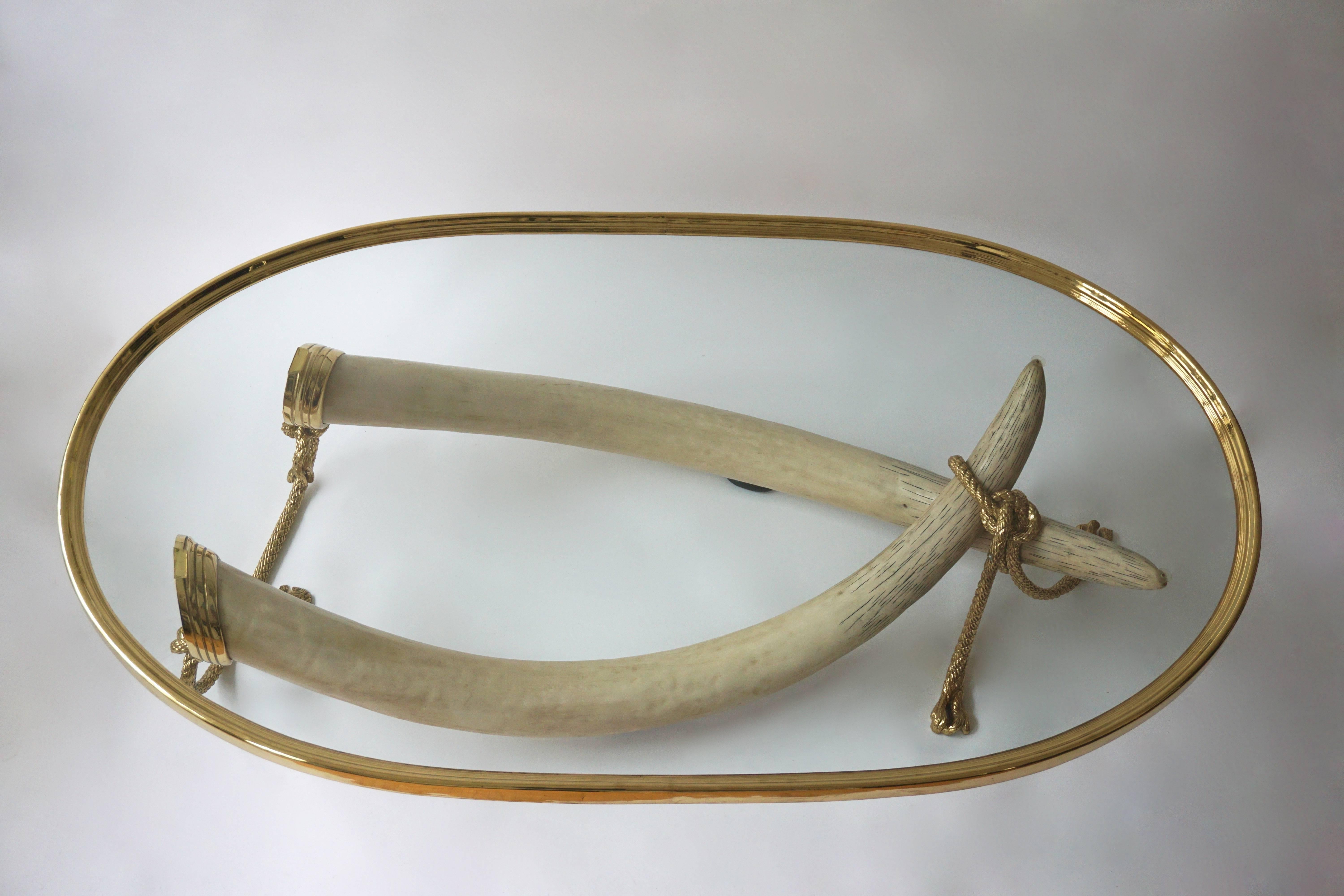 Glass and Brass Elephant Tusk Base Coffee Table by Valenti, 1970s In Good Condition In Antwerp, BE