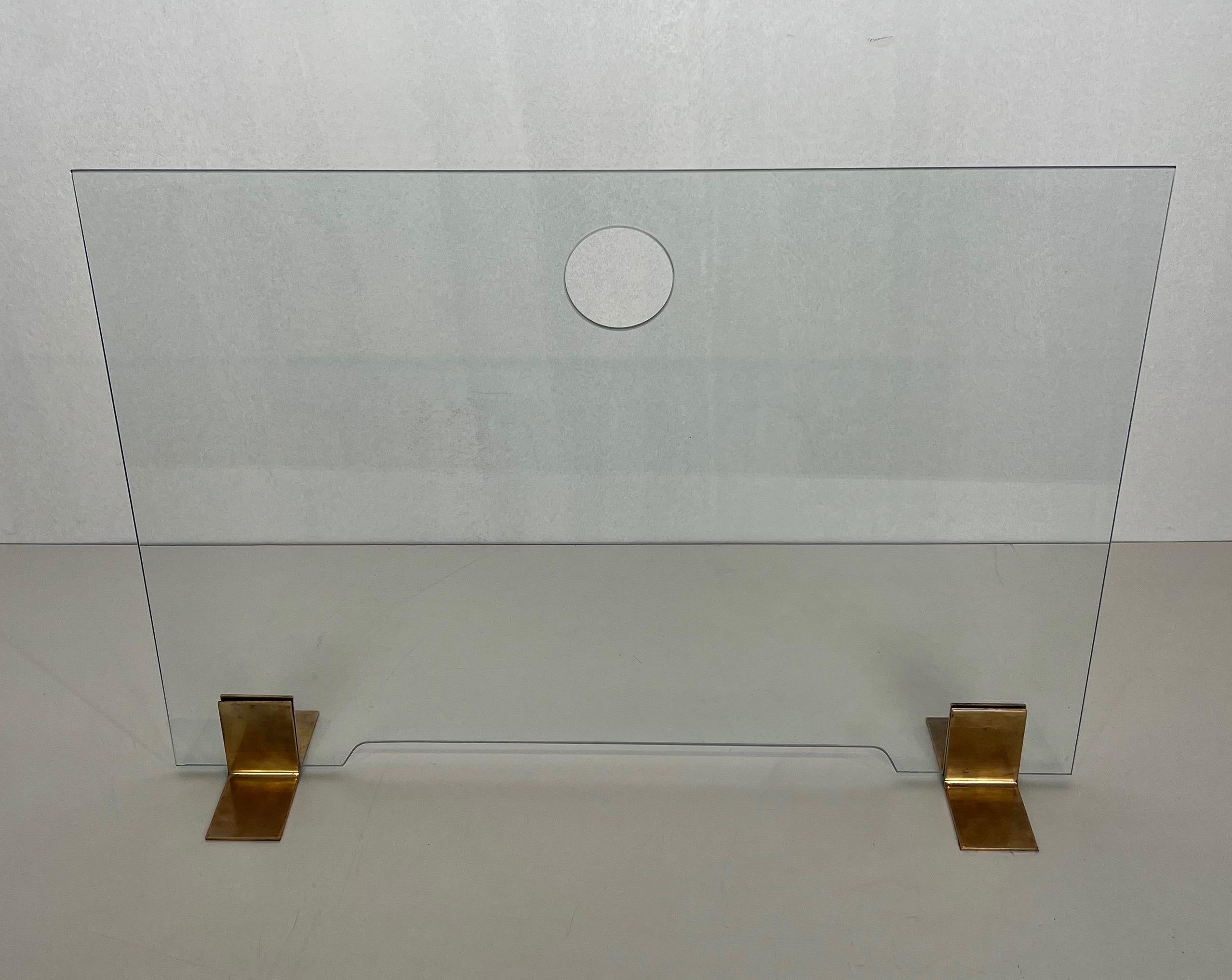 Mid-Century Modern Glass and brass fireplace screen with brass feet. French work. Circa 1970
