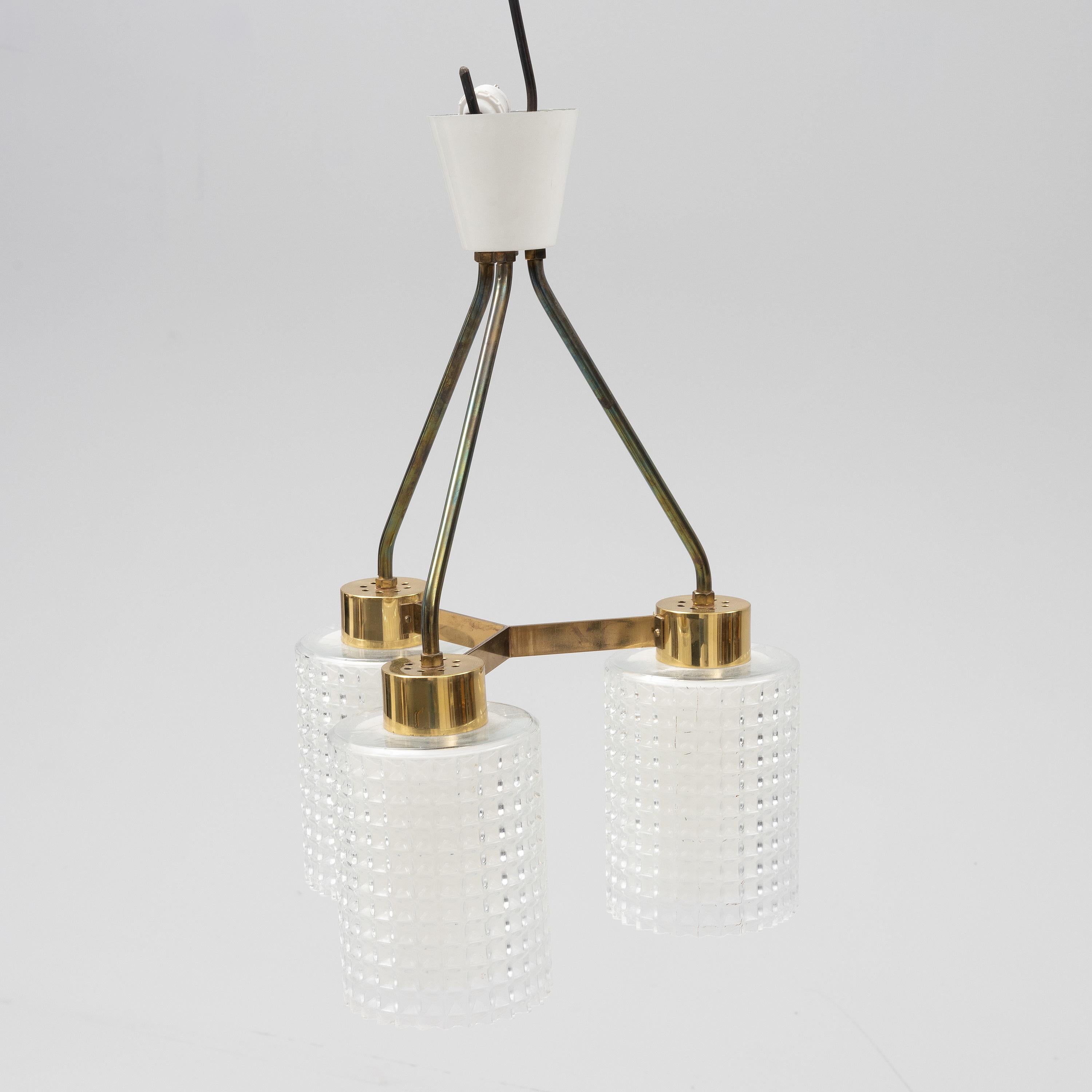 Glass and brass pendant 3 lights by Orrefors Sweden, 1960

Good overall condition.