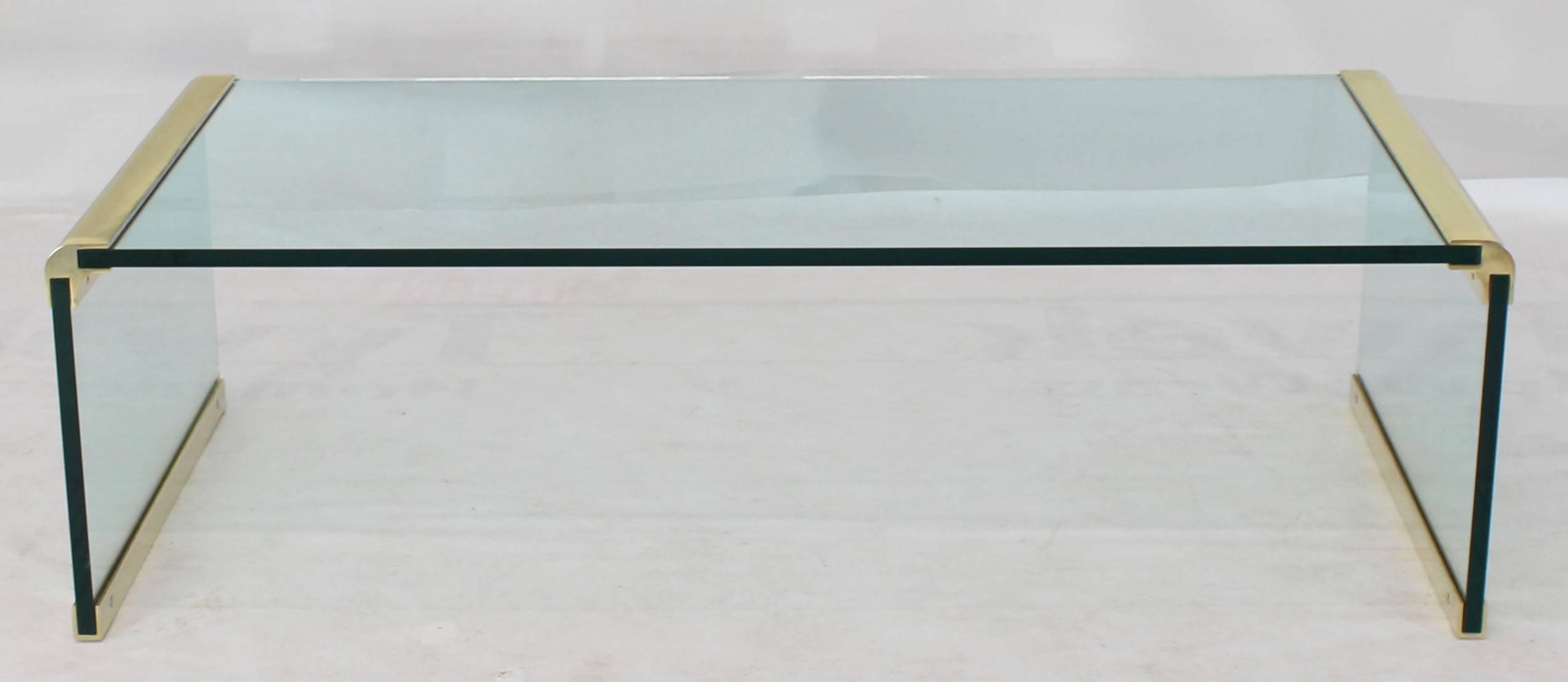 Mid-Century Modern glass and brass C Shape rectangular coffee table.